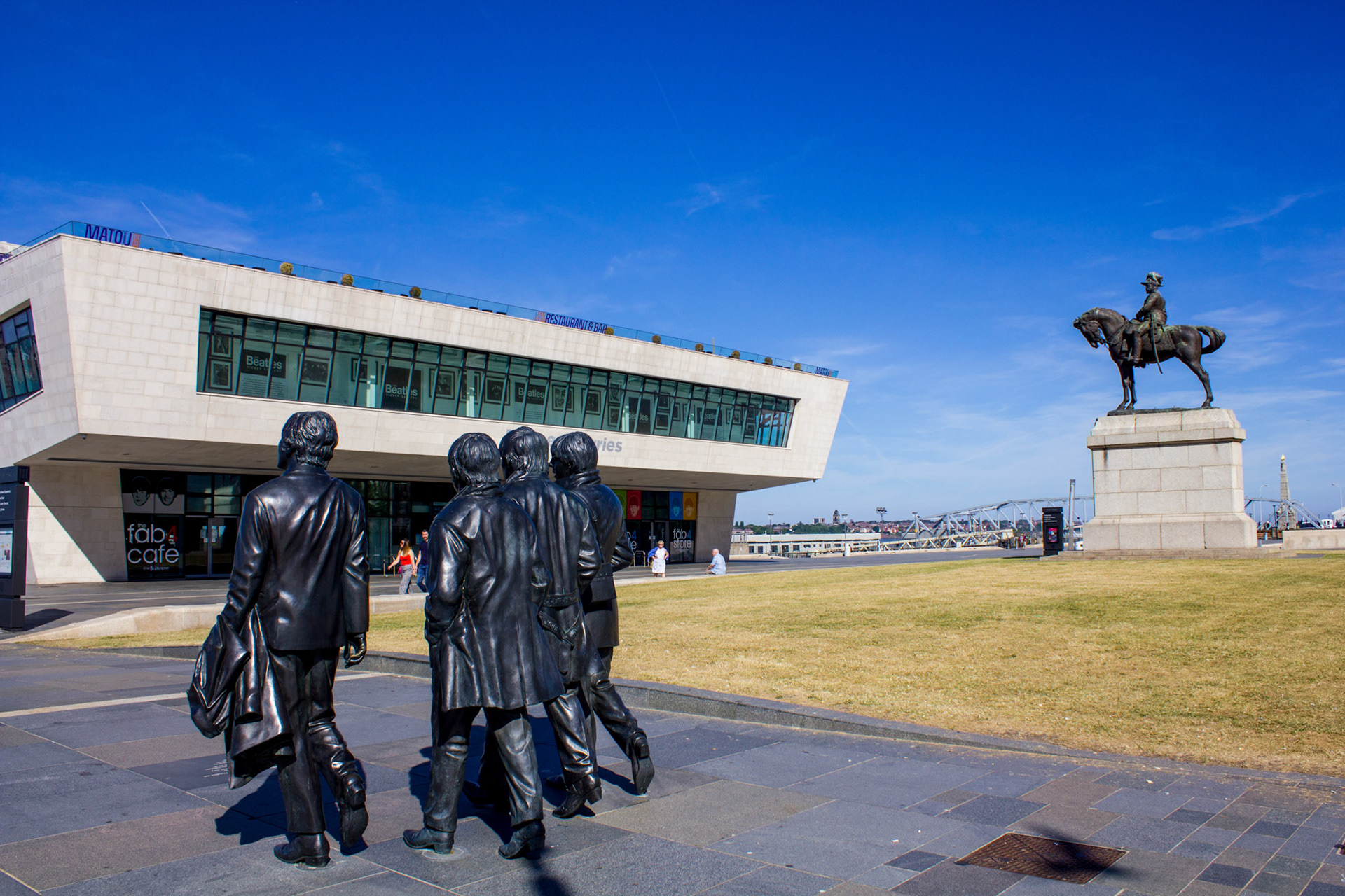 Fab Four and King George outside Mersey Ferry terminal building, 2018
