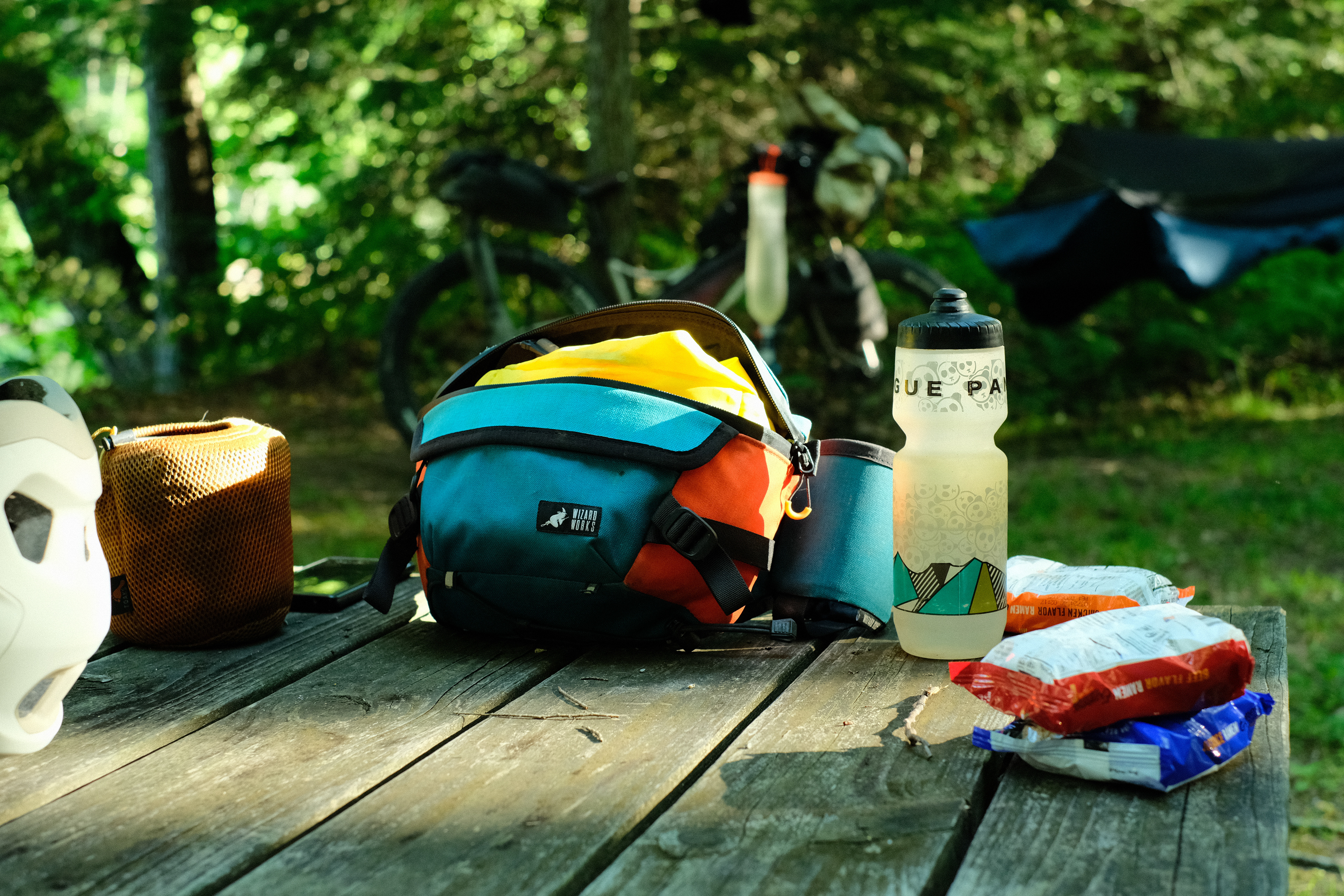 Ramen, cooking pot, and hip bag all laid out, ready for dinner at camp