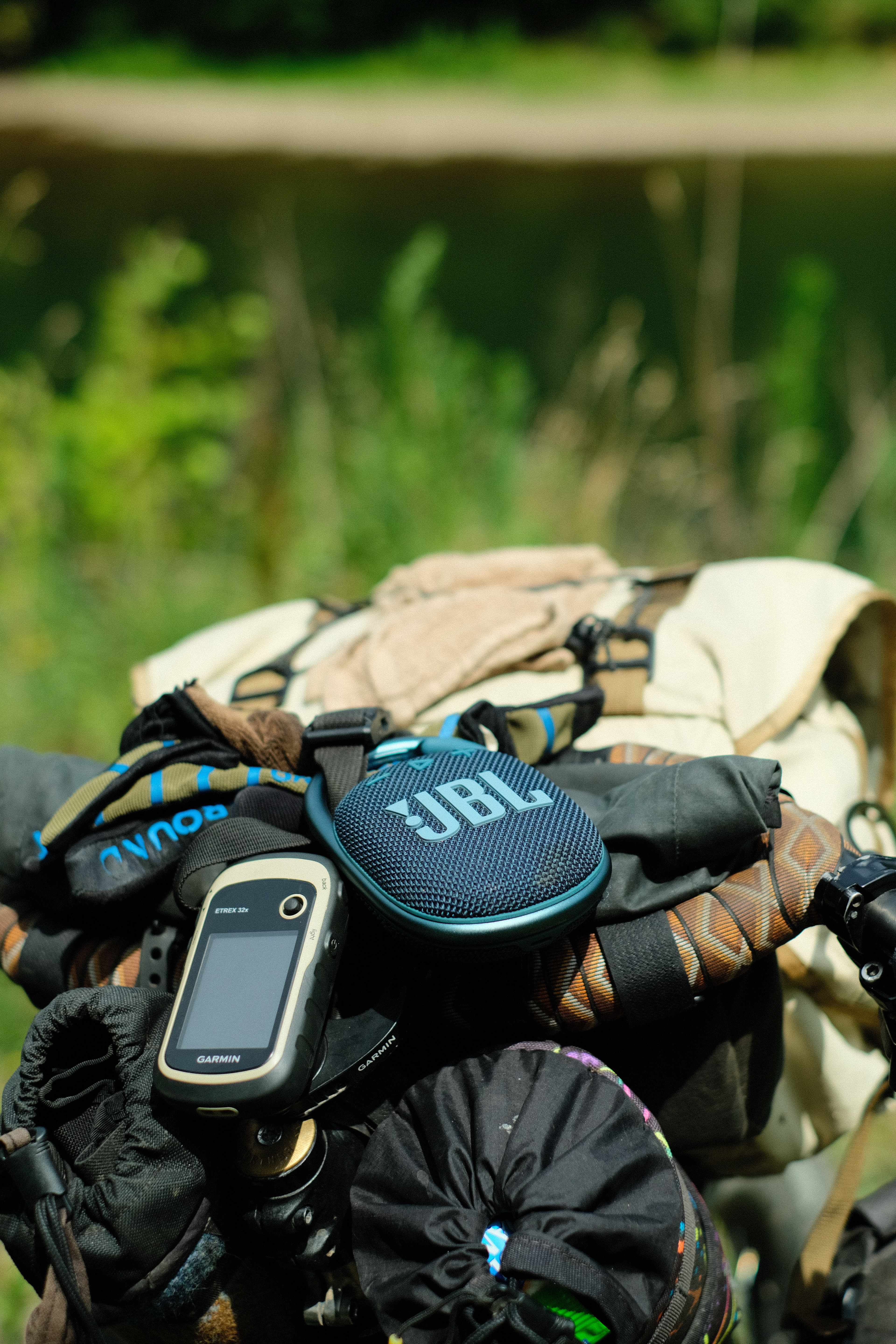 My bluetooth speaker rests atop my handlebars overlooking the Greenbrier River