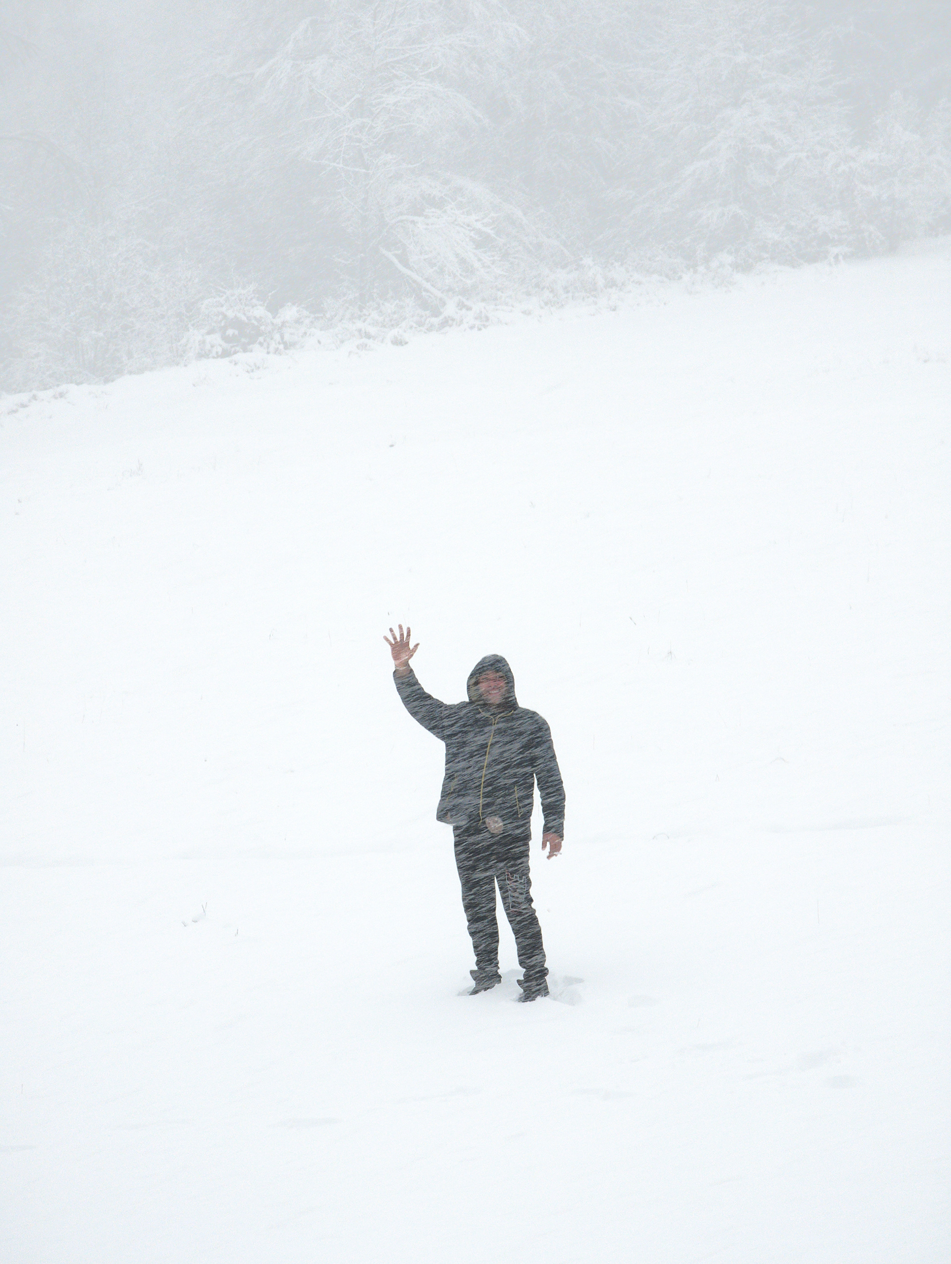 Semir waves and smokes in a blizzard. "This is Balkans," I was told