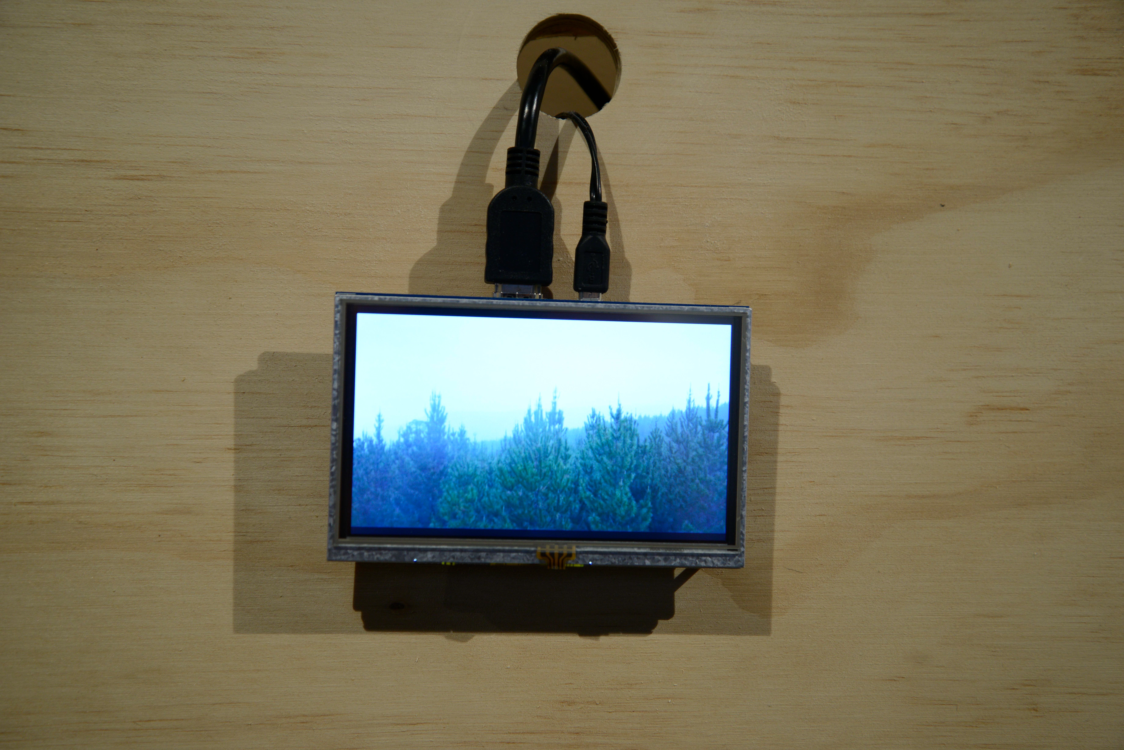 'Millionth Acre Archive' (detail). Bracing plywood, custom electronics. dimensions variable. 2017. While DJI Mavic drone videos are natively recorded in 4k, these monitors were restricted to 640x 480 resolution. The choice of small, low resolution, poor quality and visible audio-visual components in this work is intentional. This approach highlights the materials and technologies that underpin the often seamless experience of contemporary art, rather than obscuring them.