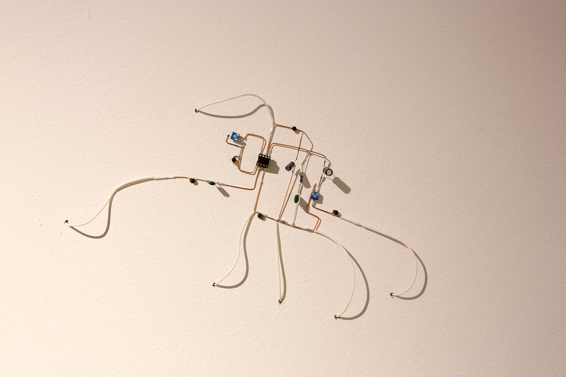 Installation detail, 'Millionth Acre'. 2015. Custom handmade electronics components, surface mounted to gallery wall.  Amplifier circuit playing back field recordings from site.  Dimensions variable.