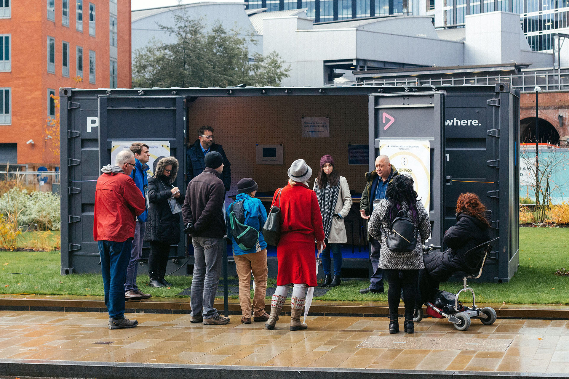 Participants gather outside the Playbox shipping container in Sovereign Square