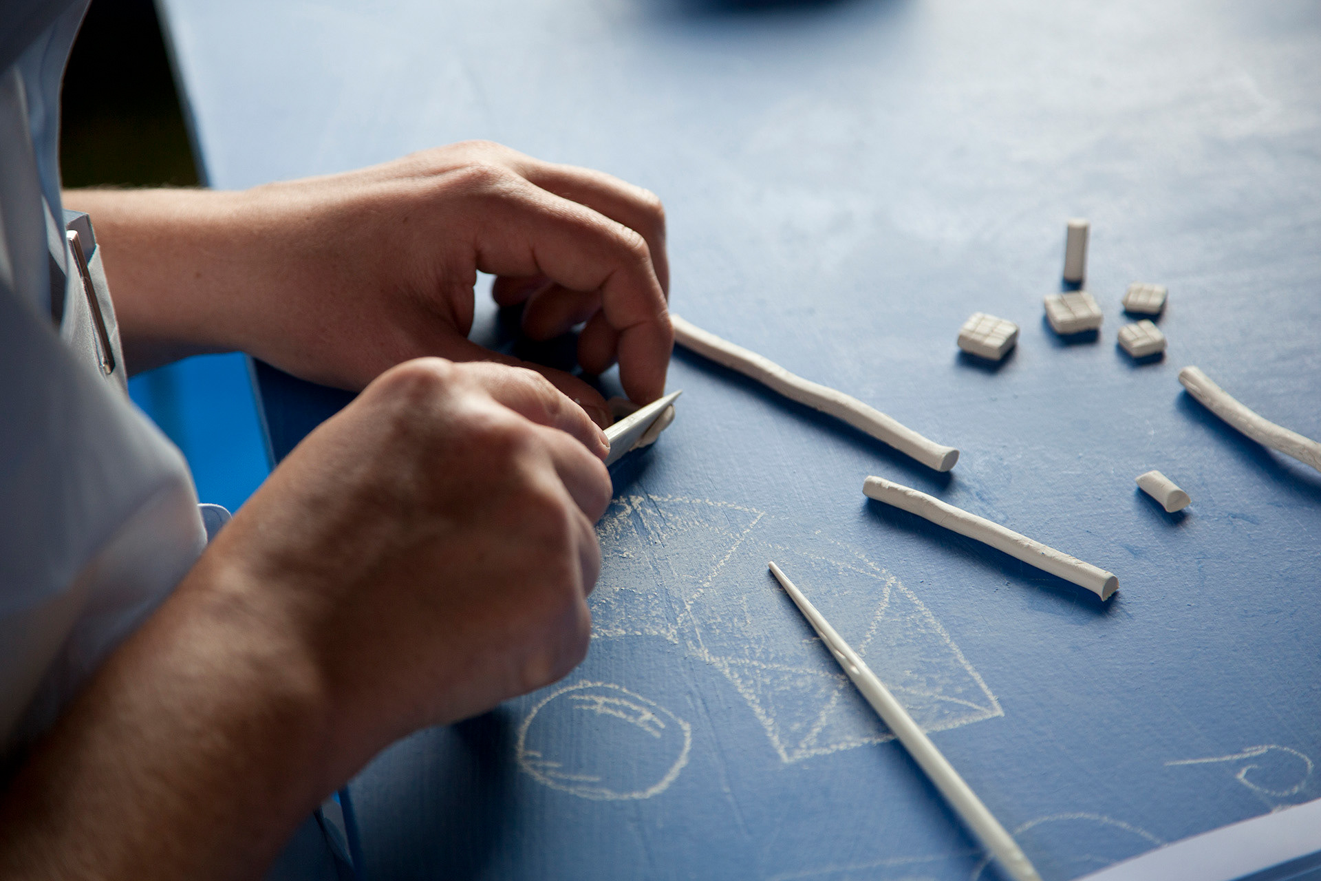 Crafting a clay model in the large gazebo