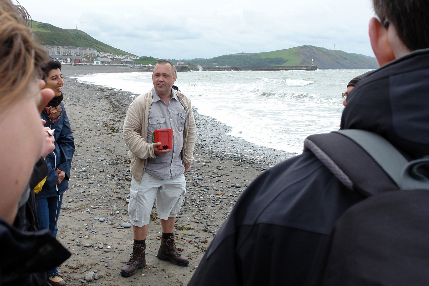 Closing words on the beach below Aberystwyth Castle