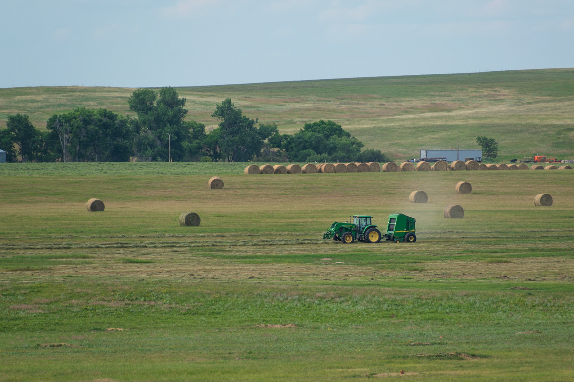 A South Dakota rancher baling hay, an almost never-ending job.