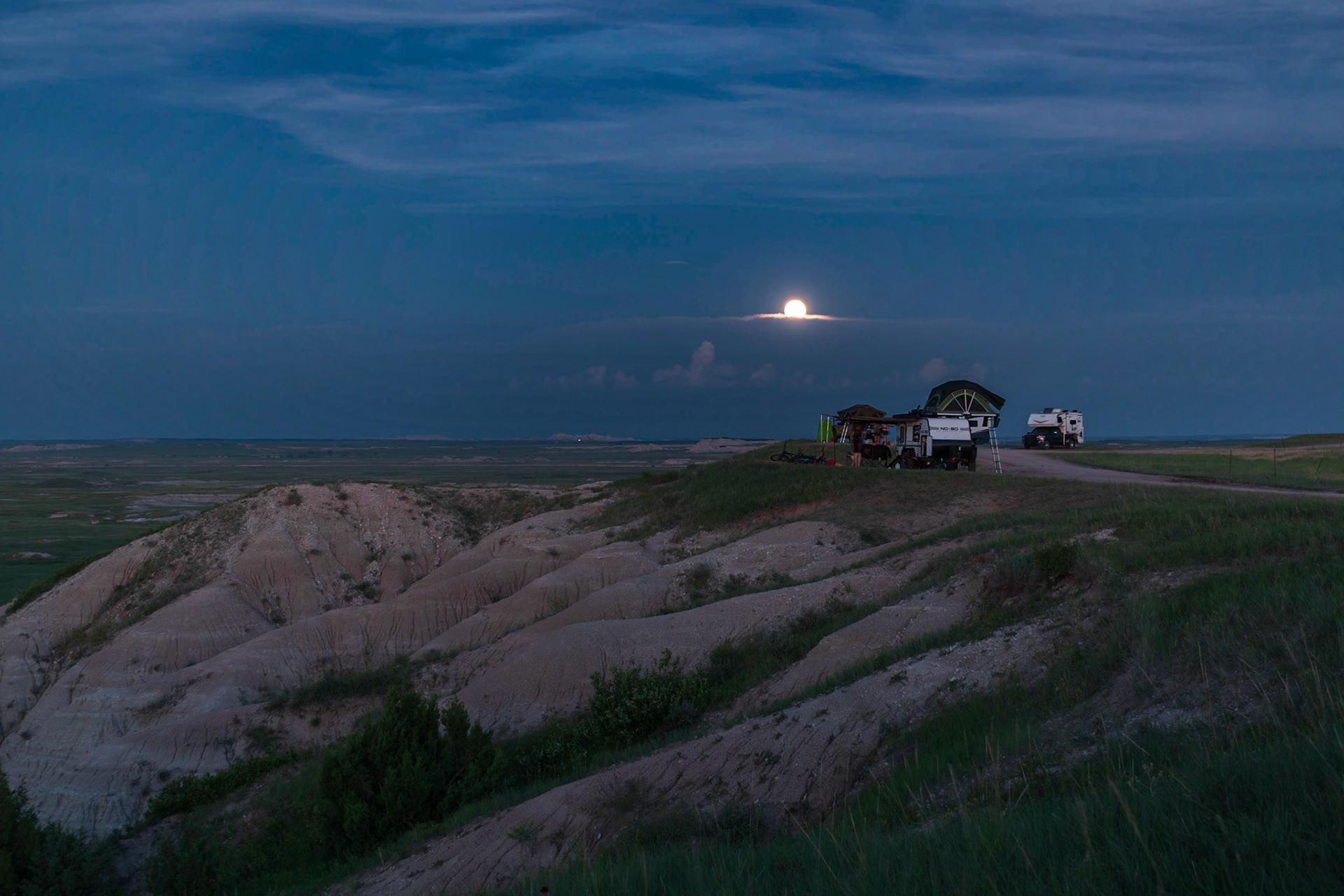 That is the moon over the camps next to us. I'm not sure about the weird bands in the sky, I don't see them in Lightroom were I edit the pictures. ??