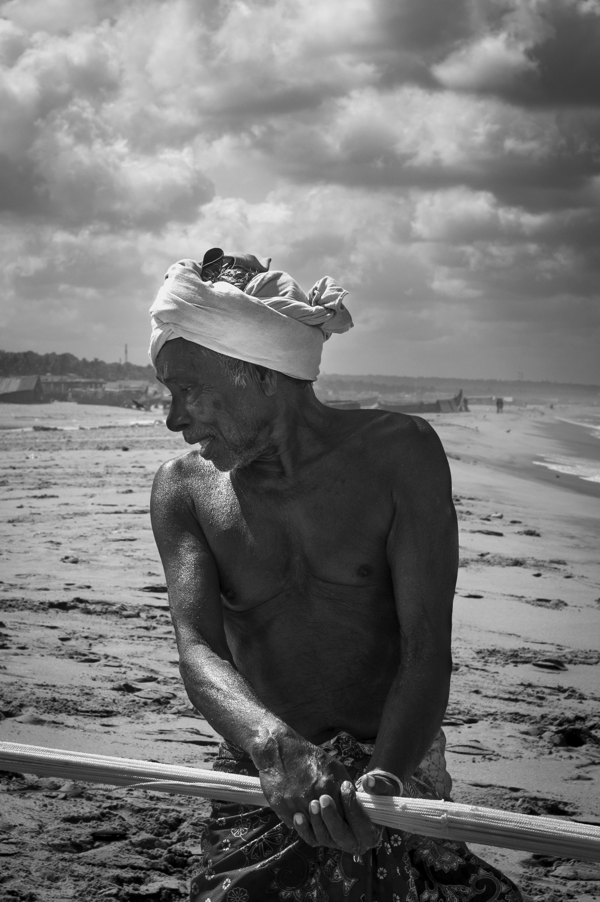 Portrait of a fisherman working on the Kerala coast.