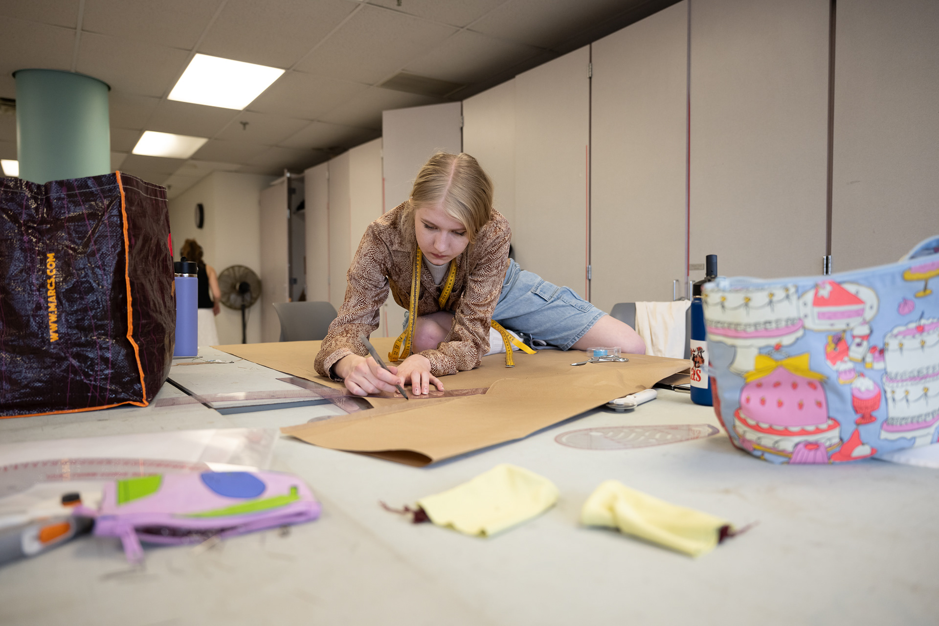 A student works on a fashiondesign project in a campus studio at Rockwell Hall.