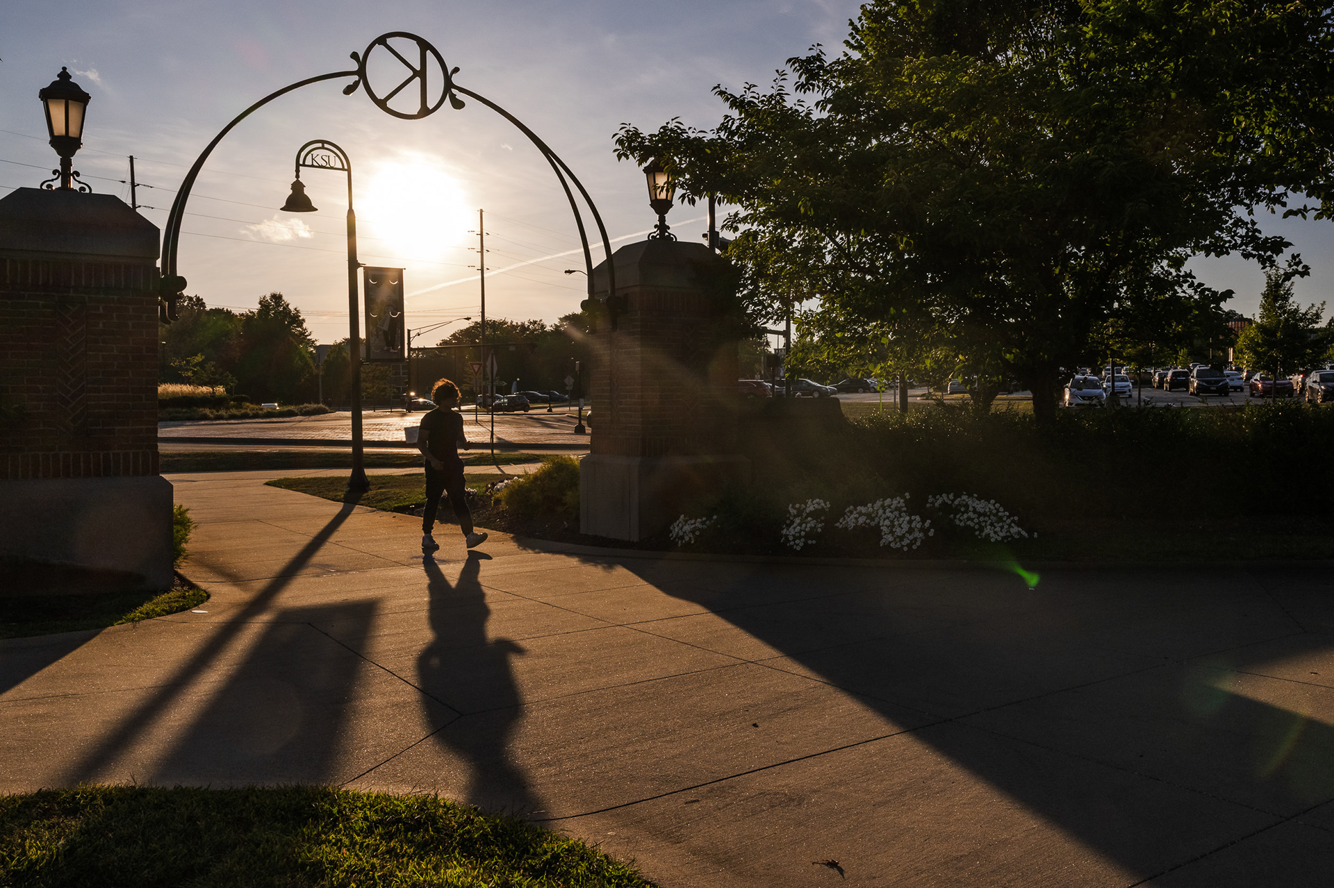 Evening light falls across the Kent State gateway.
