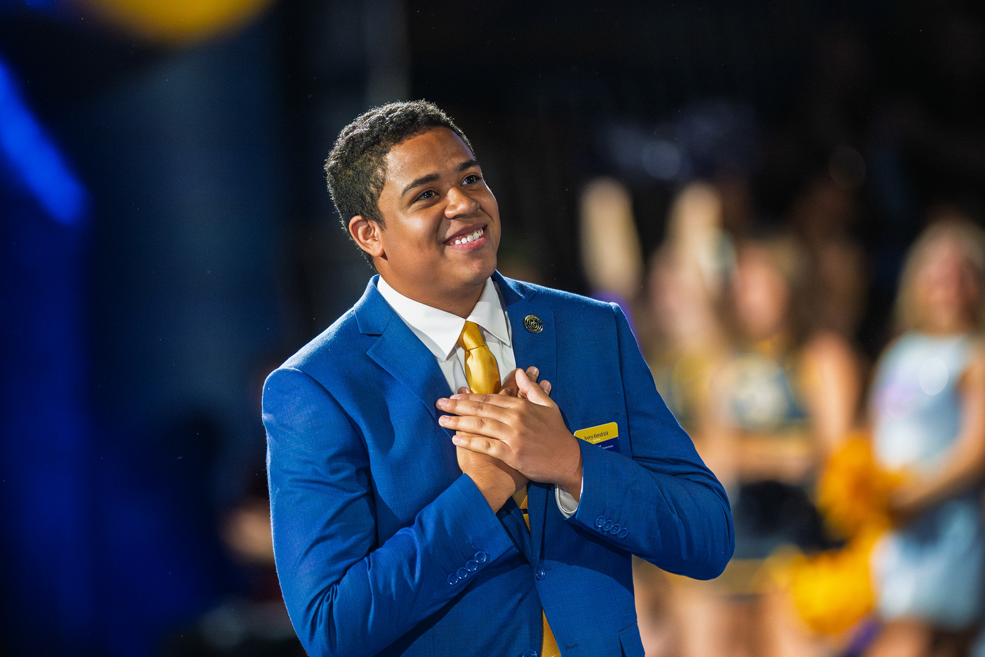 A student leader reacts during a campus event.