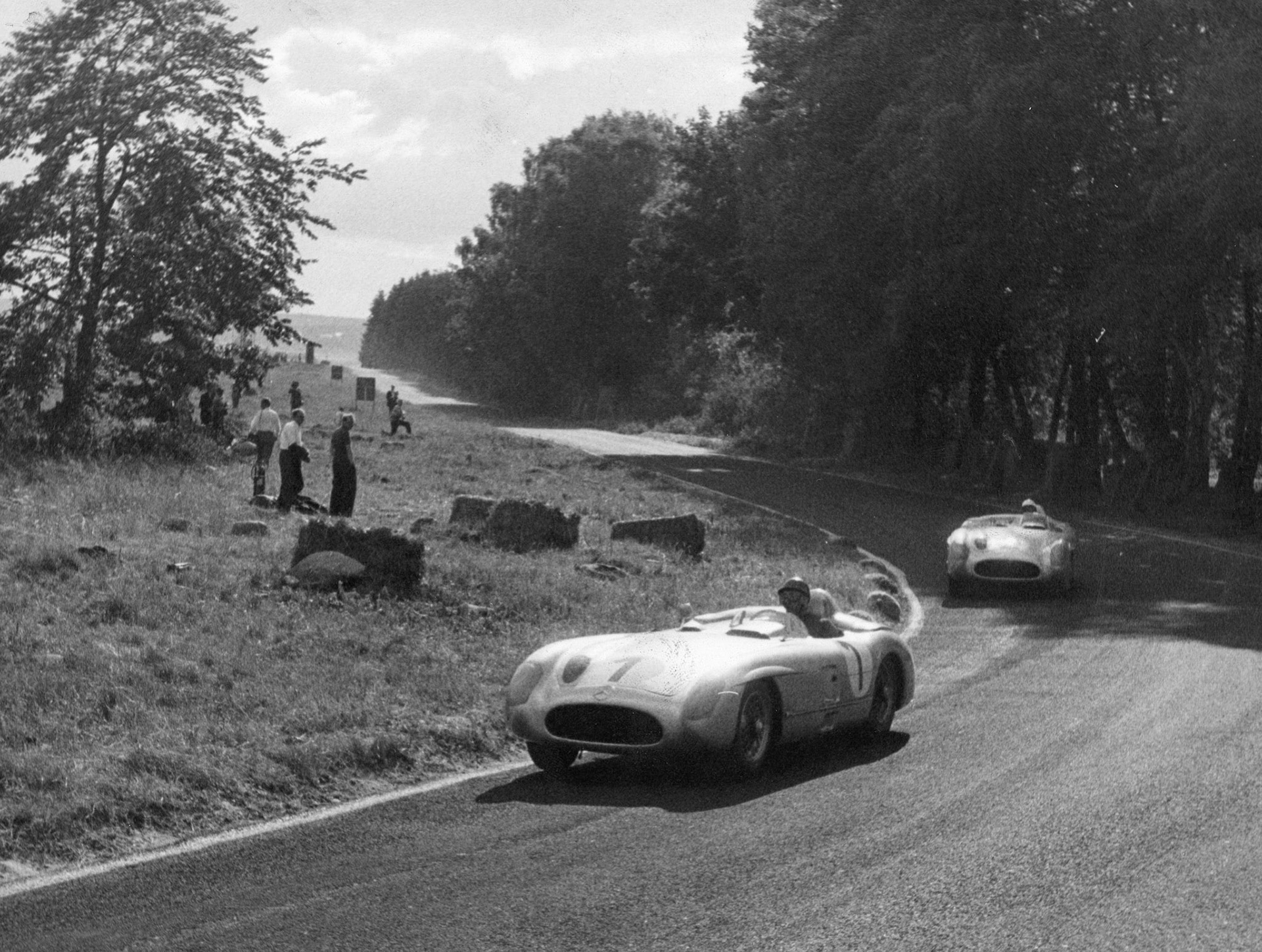 Juan Manuel Fangio (1) and Stirling Moss (2) at the 1955 Sweden Grand Prix, driving the Mercedes-Benz 300SLR (Continental)