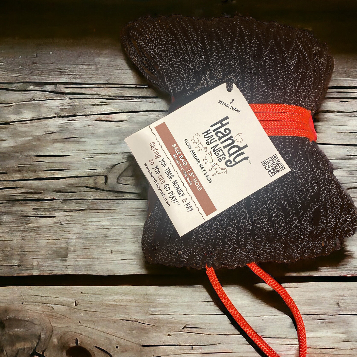Photo of a wrapped up Handy Hay Nets Bale Bag 1.5" hole with logo/product label designed by Sequoia Design