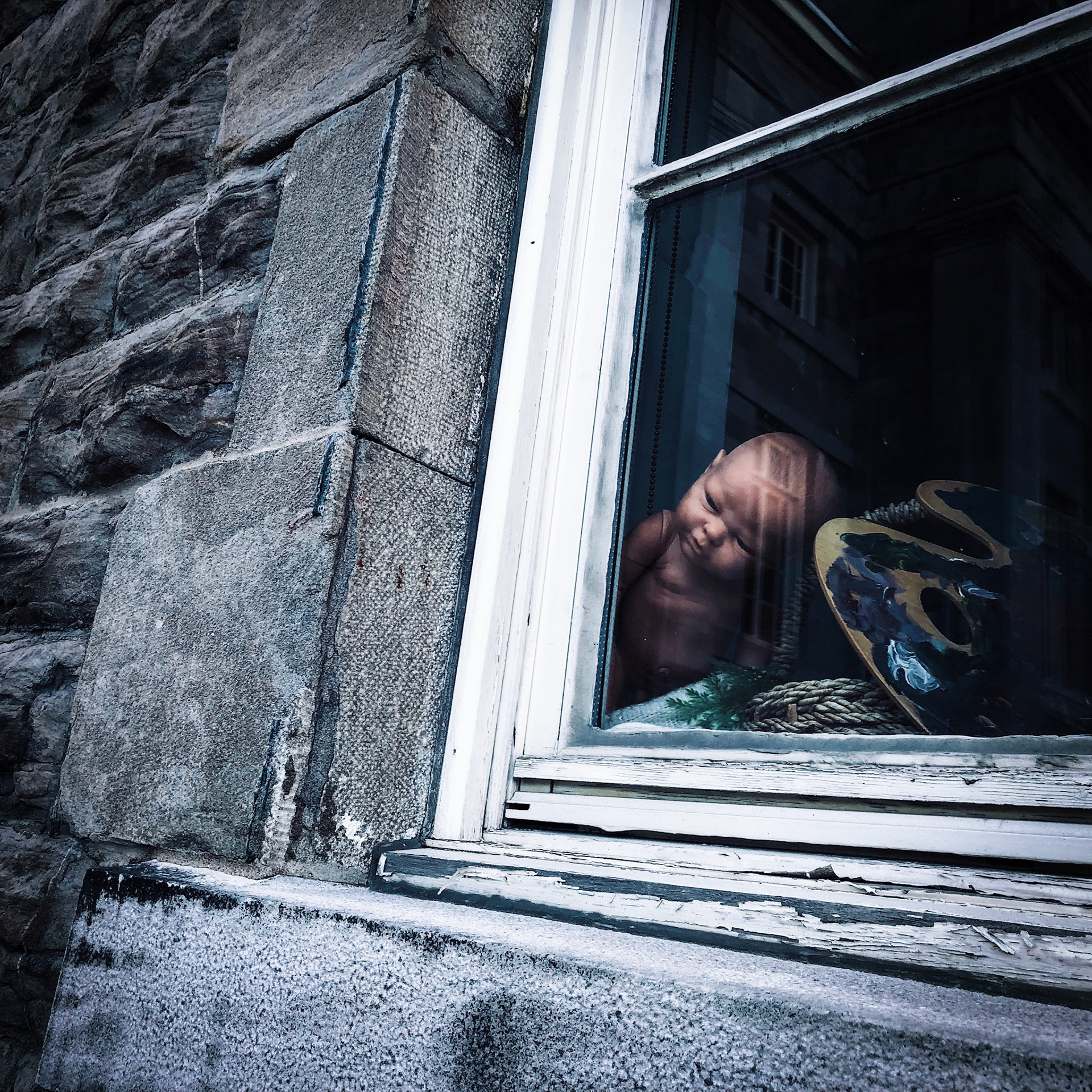 Creepy doll at the window