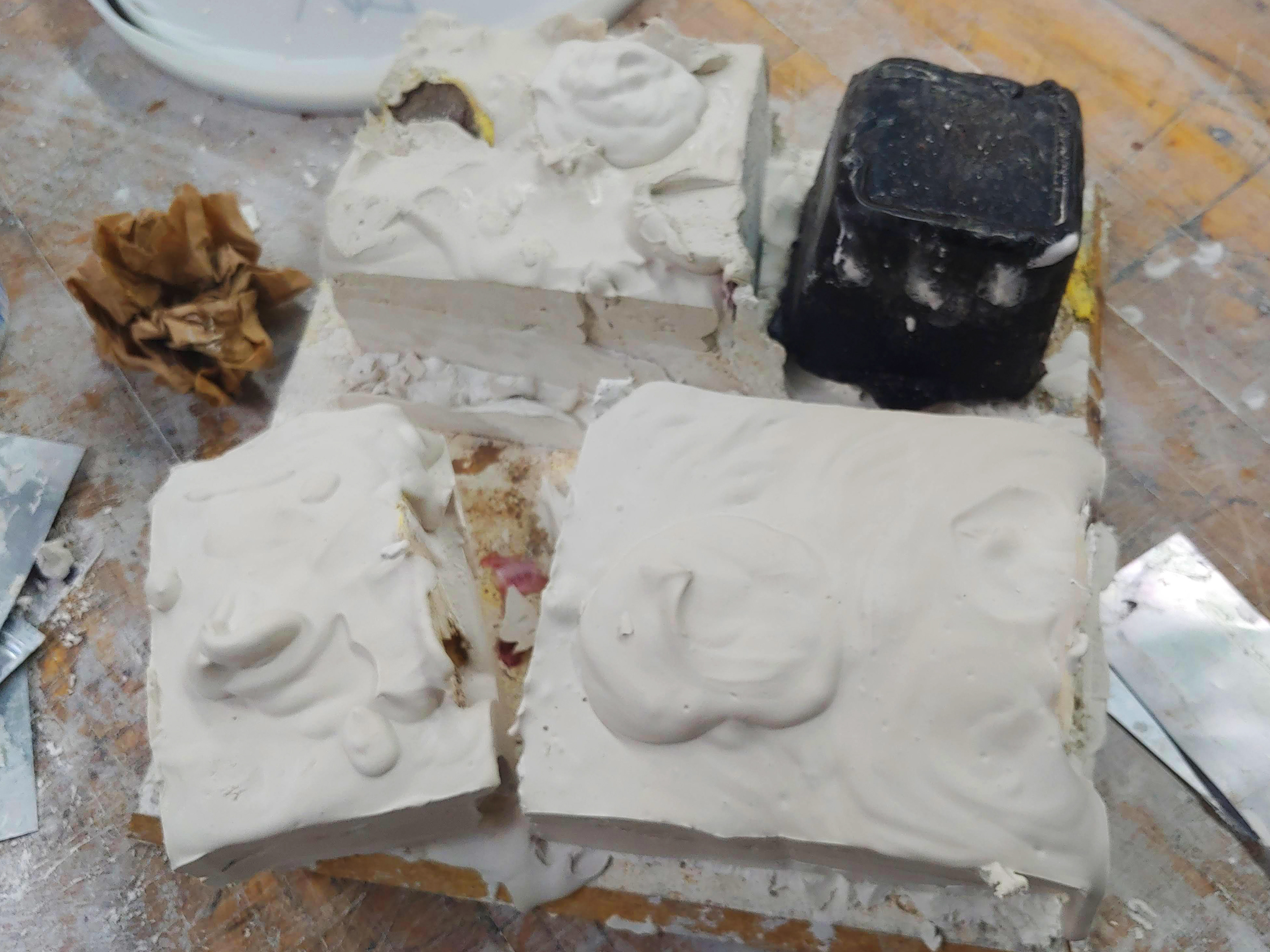Each silicone mold was covered in a plaster mother mold.