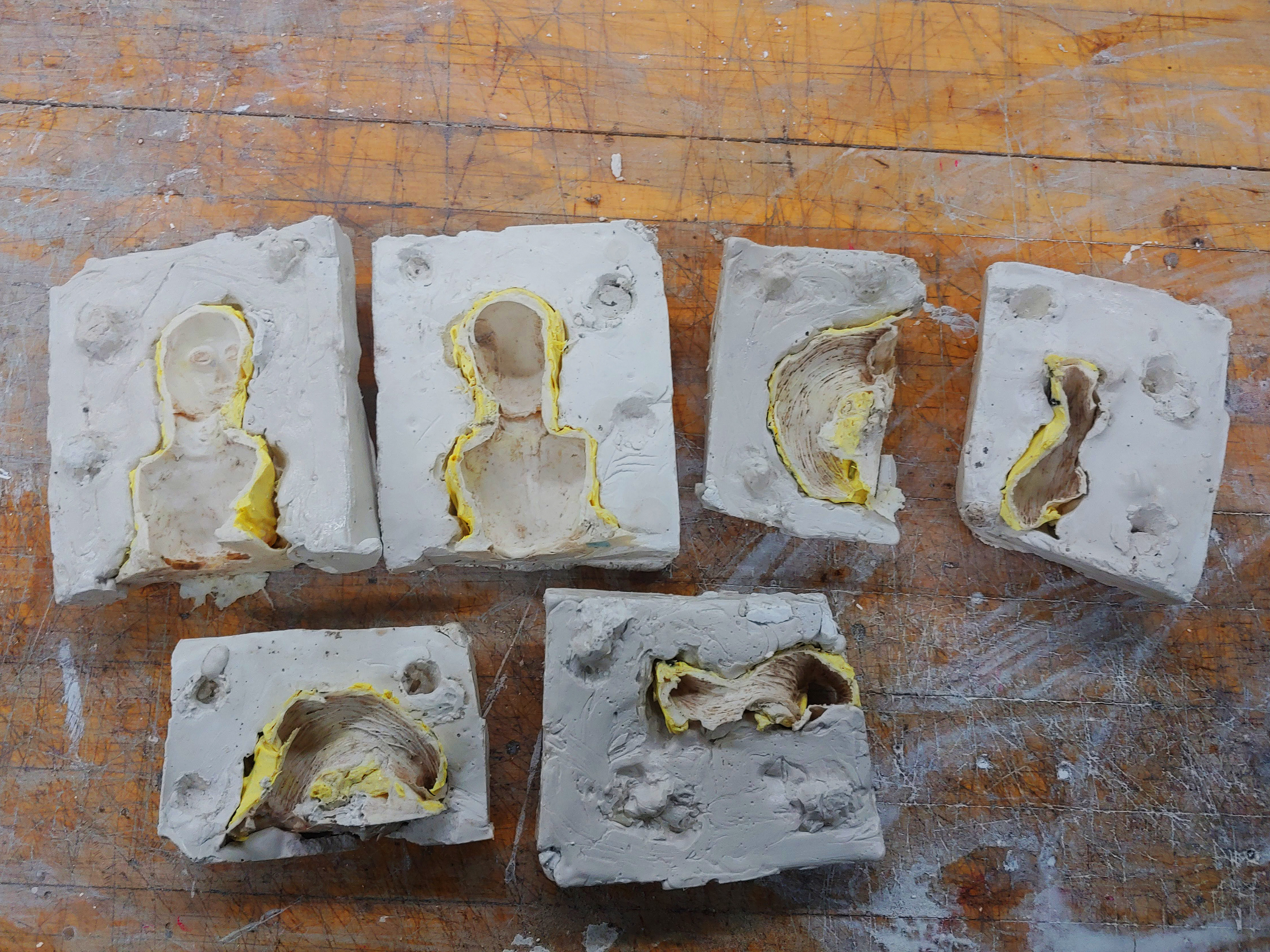 The molds were split apart and the clay was cleaned out from the rubber.