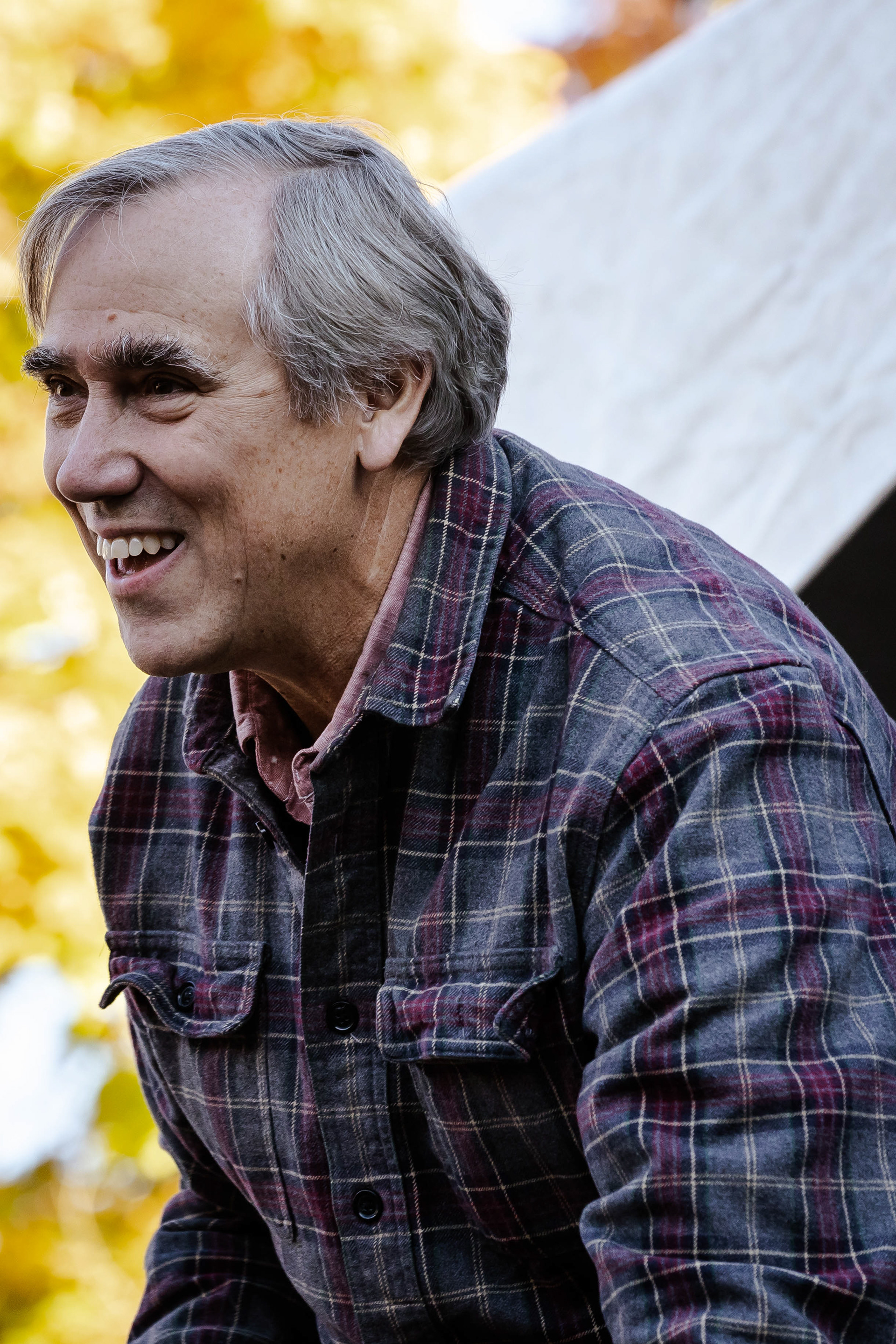 Democratic politician Jeff Merkeley smiles at the crowd in the middle of his speech. Vermont Senator Bernie Sanders joined Oregon’s Democratic party leaders at the University of Oregon’s Erb Memorial Union for a rally in support of Oregon Democrat Gubernatorial candidate Tina Kotek, on Thursday, Oct., 27th, 2022. (Maddie Stellingwerf/ Emerald)