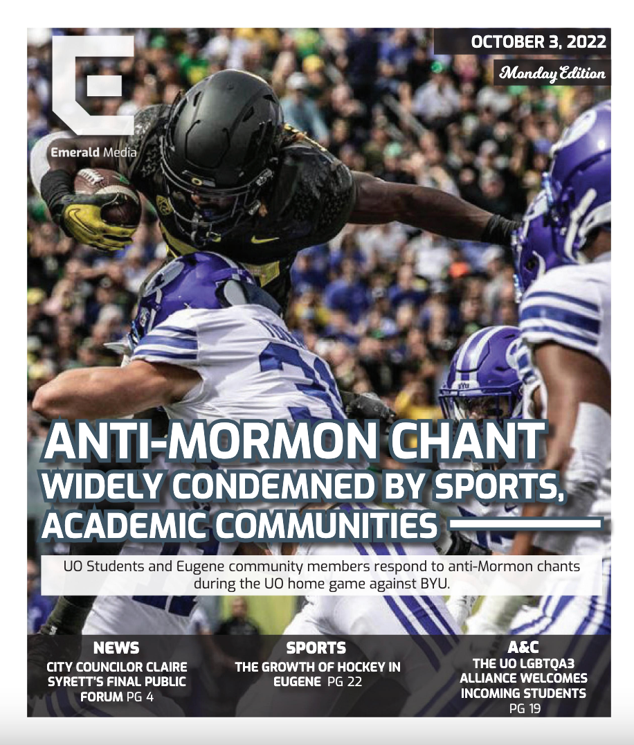 Sophomore running back Noah Whittington (22) continues to jump over Cougar defense in order to make a first down. University of Oregon Ducks Football defeat the BYU Cougars in a home match at Autzen Stadium in Eugene, Ore., on Sep. 17, 2022. (Maddie Stellingwerf/Emerald)