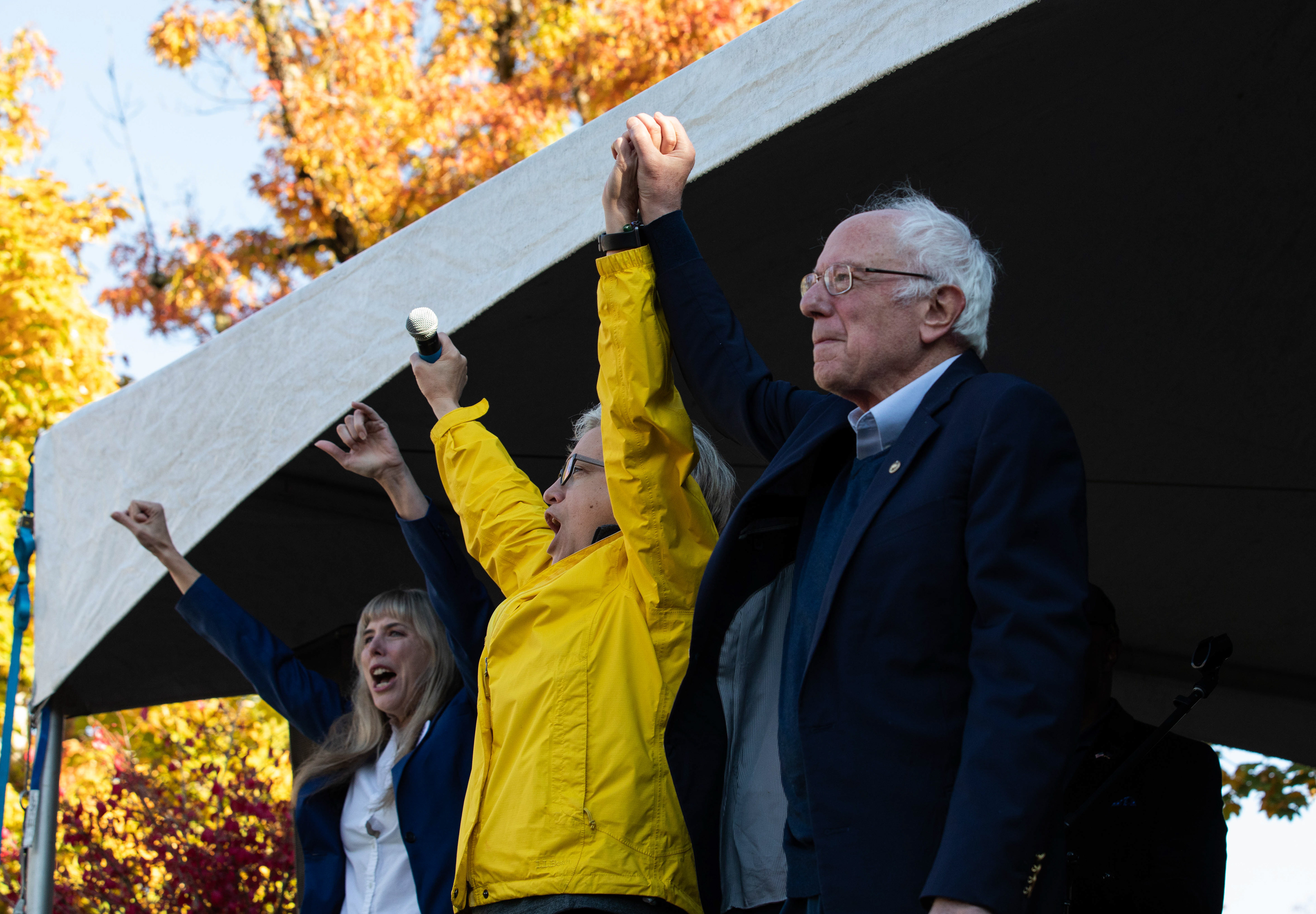 Tina Kotek and Bernie Sanders raise their hands in a joint showing of support for each others political work prior to Sanders speech at the rally. Vermont Senator Bernie Sanders joined Oregon’s Democratic party leaders at the University of Oregon’s Erb Memorial Union for a rally in support of Oregon Democrat Gubernatorial candidate Tina Kotek, on Thursday, Oct., 27th, 2022. (Maddie Stellingwerf/ Emerald)