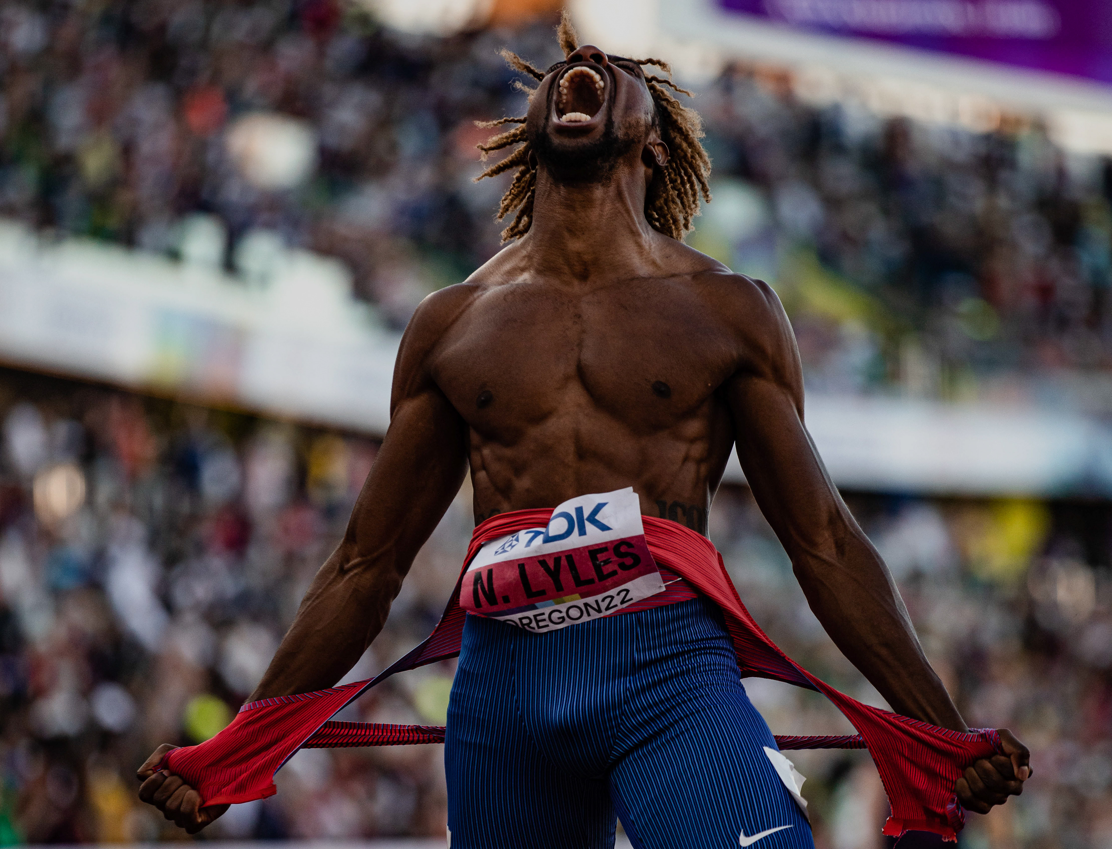 Noah Lyles of the United States rips his jersey in half in celebration of earing a gold medal in the Mens 200m final. Day seven of the 2022 World Athletic Championships takes place at Hayward Field on July 22, 2022. (Maddie Stellingwerf/Emerald)