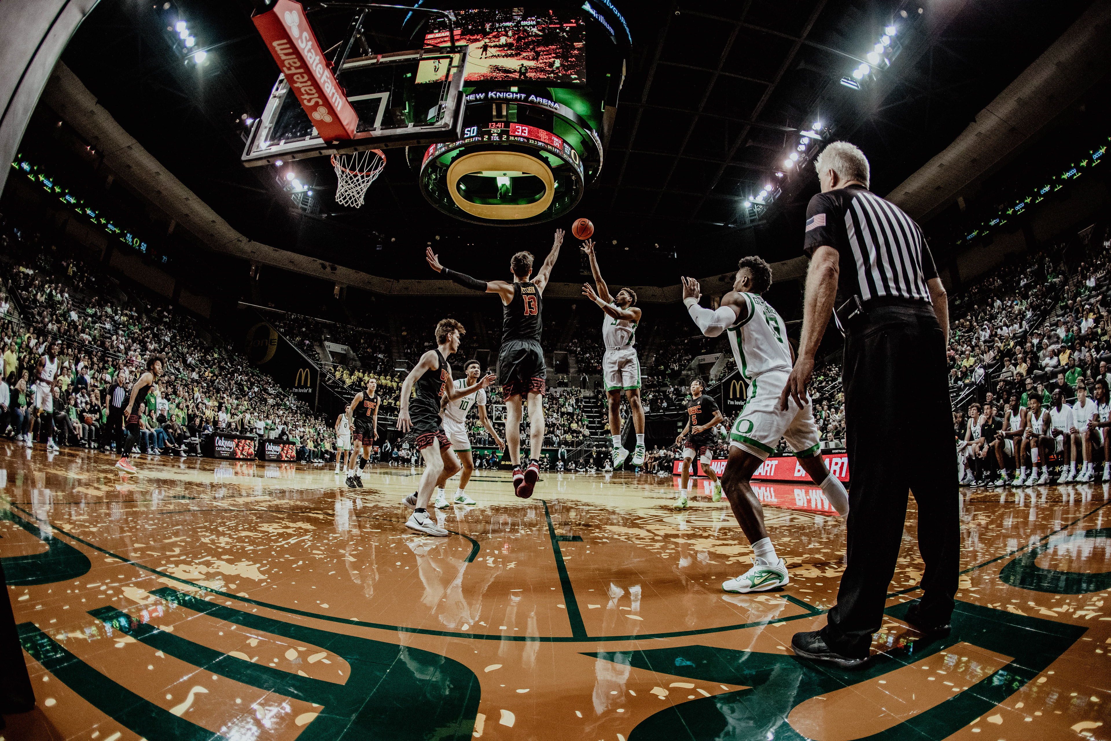 Ducks guard Keeshawn Barthelemy (3) makes a jumpshot against Trojans defense. University of Oregon Mens Basketball defeat the USC Trojans 78-60 at Matthew Knight Arena in Eugene, Ore., on Feb. 9, 2023. (Maddie Stellingwerf/Emerald)