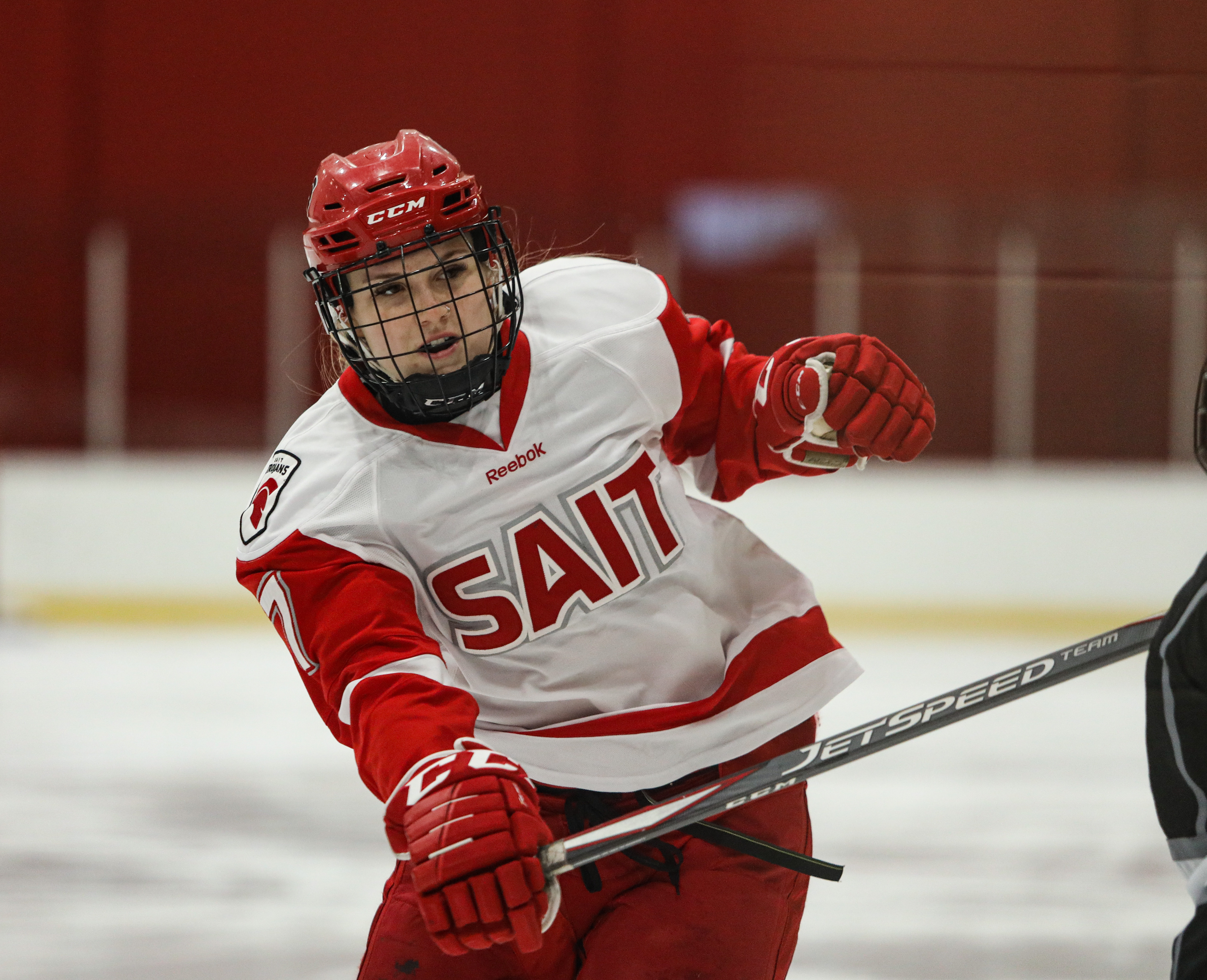 SAIT Trojans forward Brynn Ferguson whisks the puck away from Red Deer at the SAIT arena.