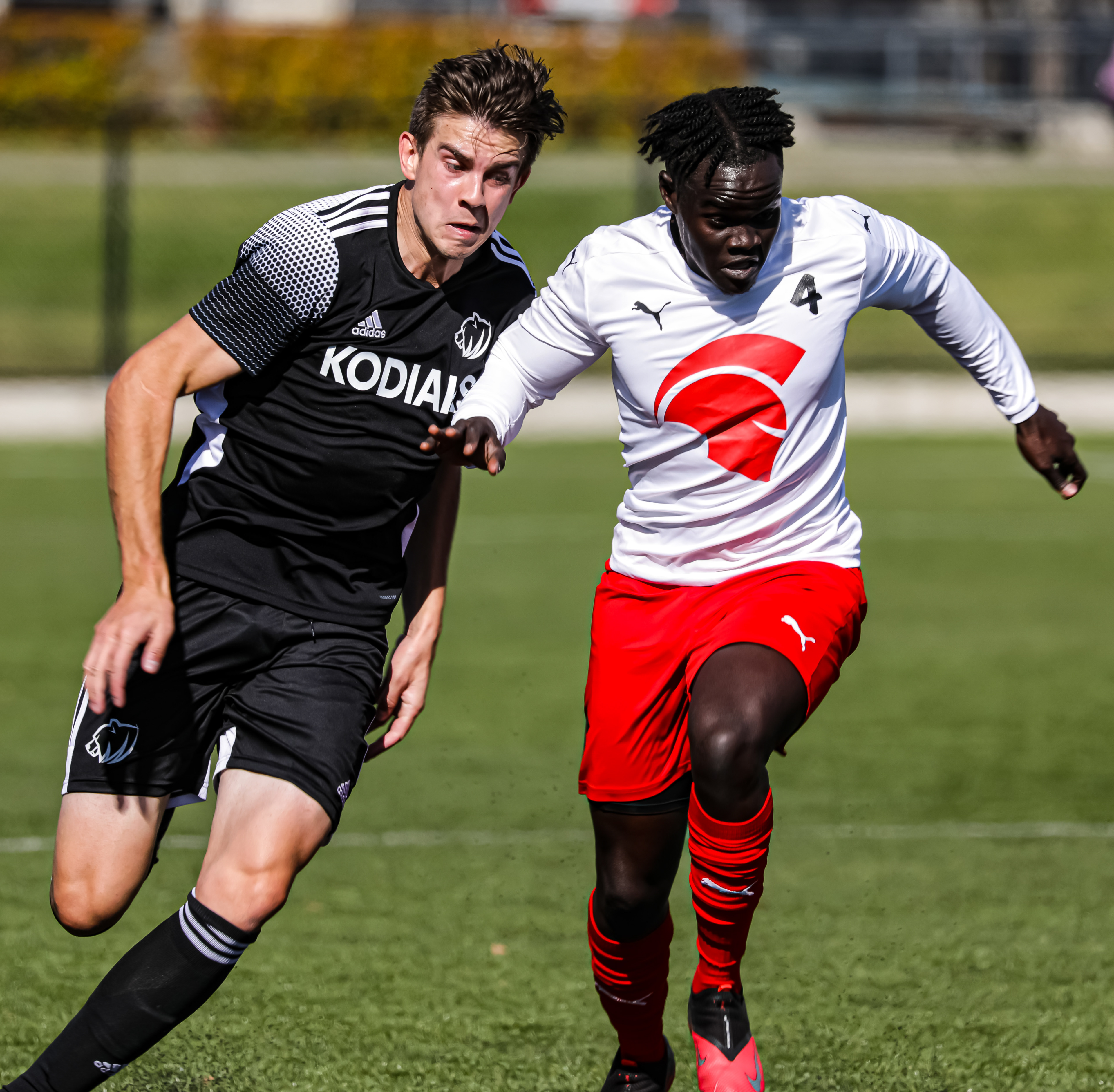 SAIT Trojans Defense David Loturi, right, runs to take the ball against the Lethbridge College Kodiaks at SAIT’s Cohos Commons Field in Calgary on Friday, Oct. 1,2021. The Trojans beat the Kodiaks by a score of 2-1 in Alberta College Athletic Conference men’s soccer action.