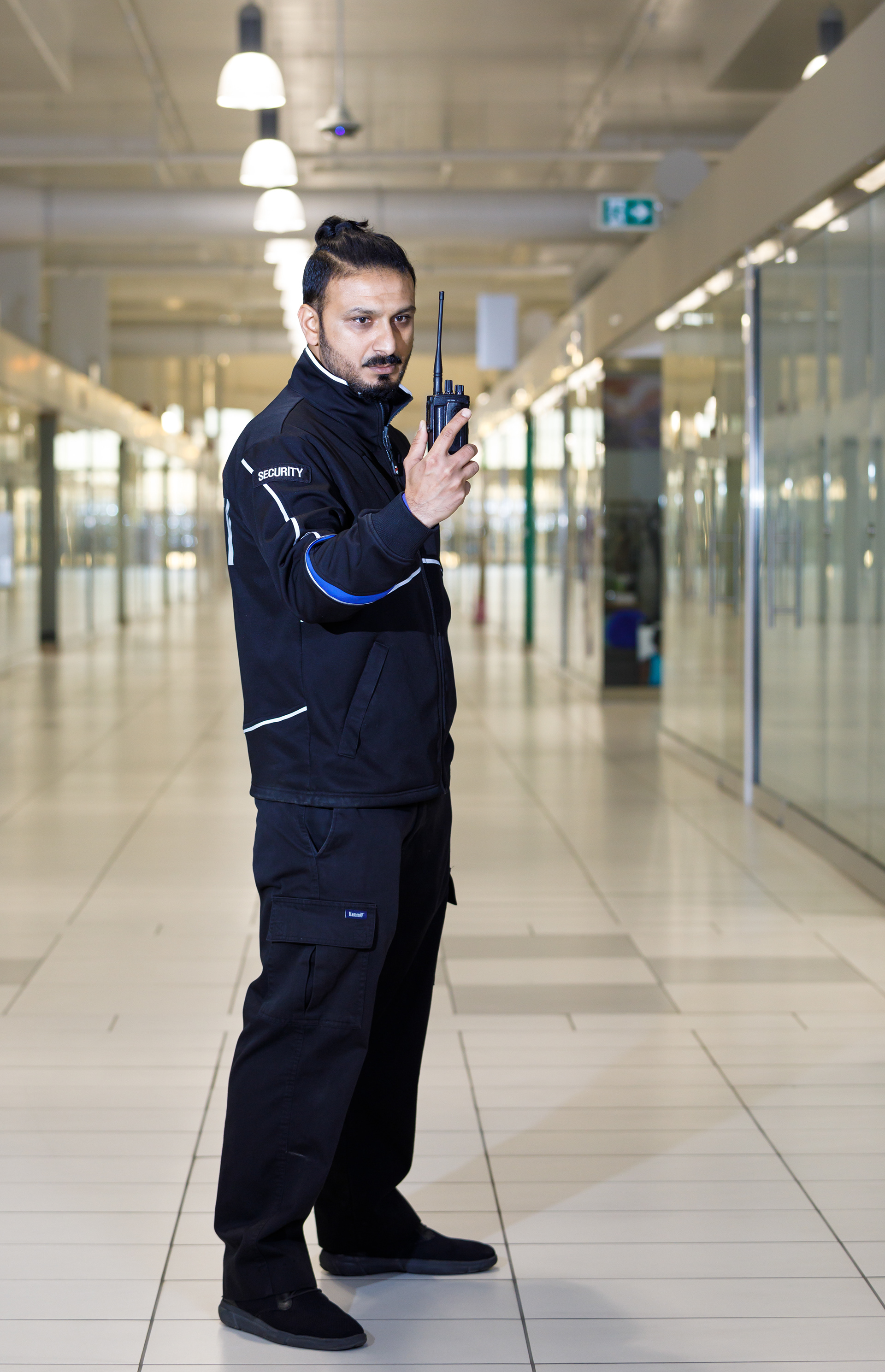 Tanka M. Gautam, a security guard, poses for a portrait at his workplace New Horizon Mall in Calgary on  Saturday, Nov. 6, 2021. 