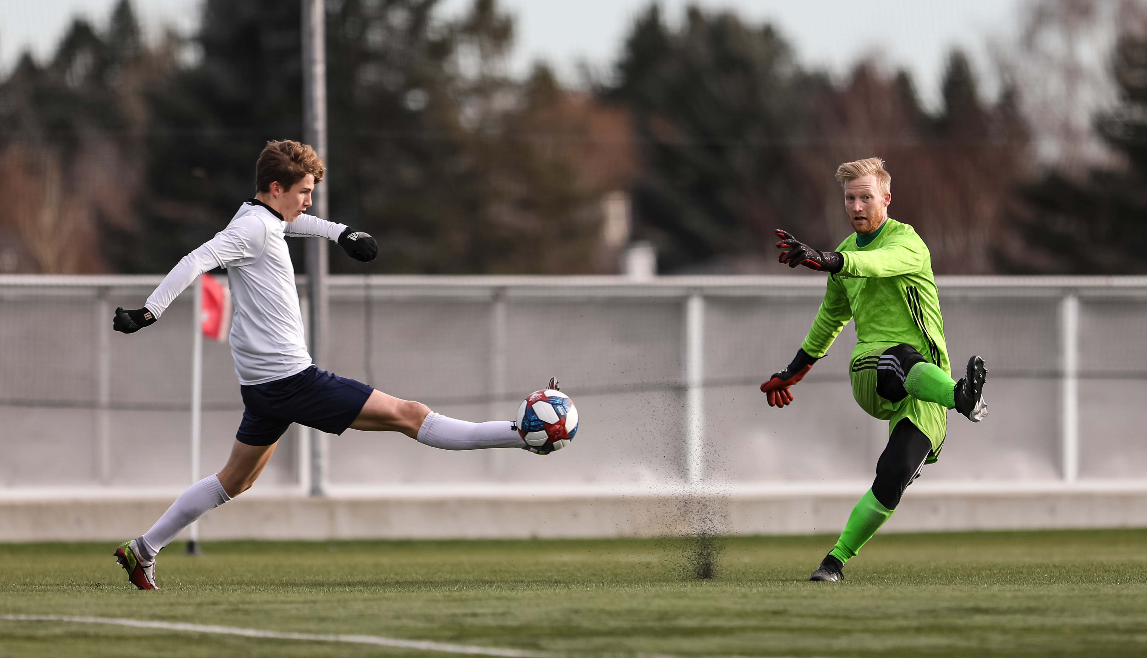 The NAIT Ooks keeper Zach Black, right, blocks the Montmorency College Nomades defender Yonis Jama, left, kick in men’s soccer action .