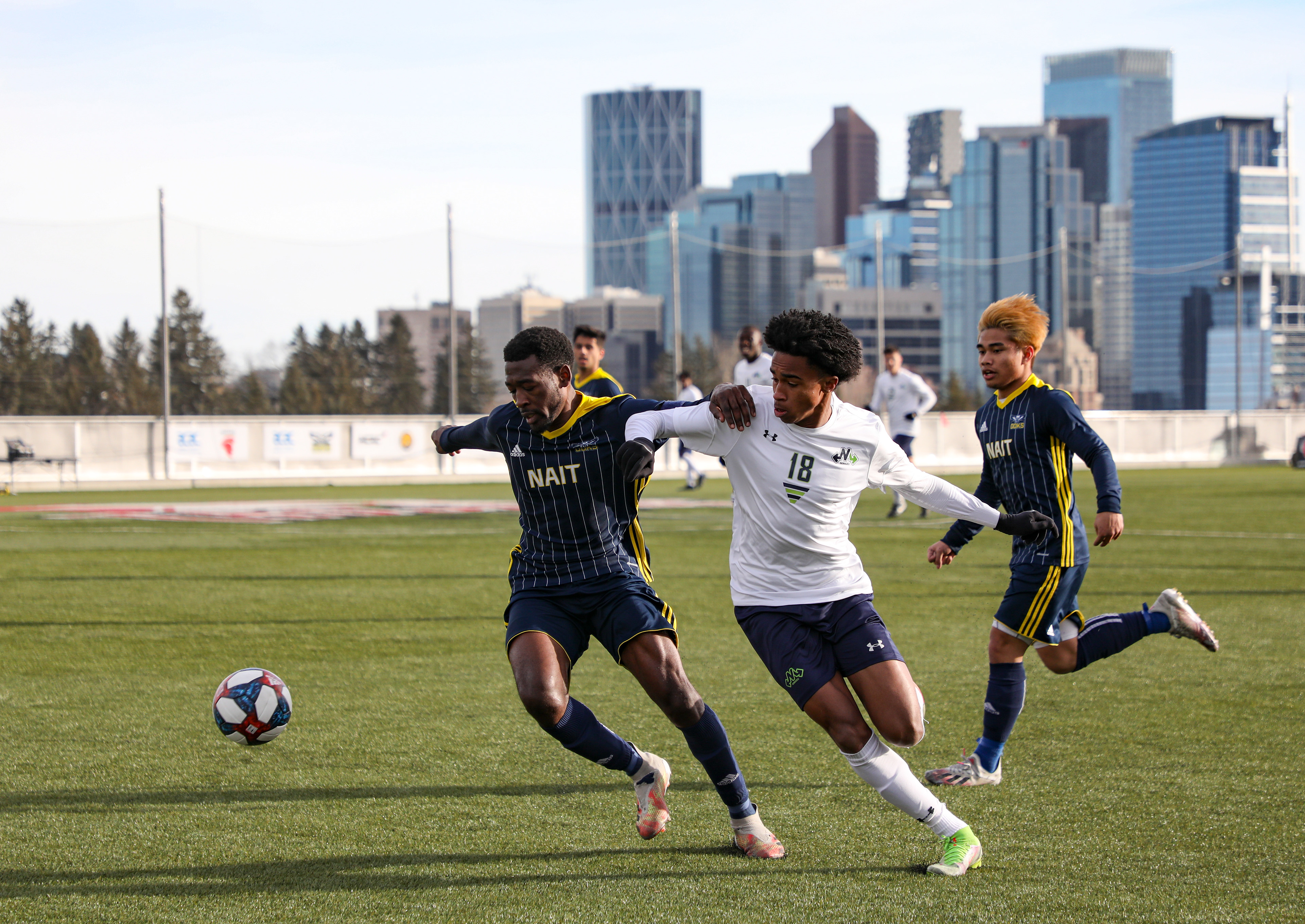 The Montmorency College Nomades defender Javae Hall, right, take on the NAIT Ooks defender Javier Cassie, left, in men’s soccer action .