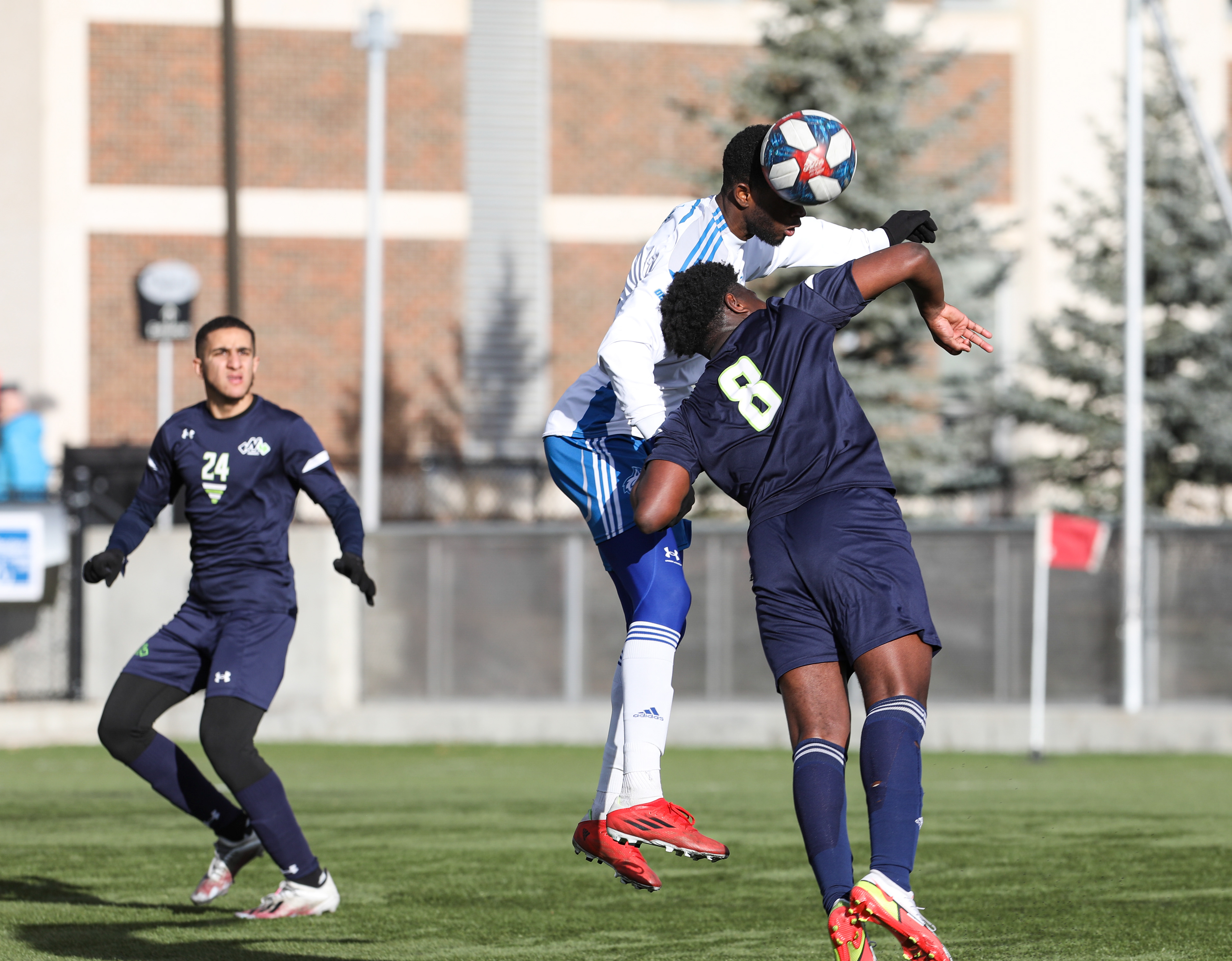 The Montmorency College Nomades defender Xavier Bitondo-Nanga, right, and the George Brown College Huskies forward Christopher Badibengi jump in the men’s soccer action.