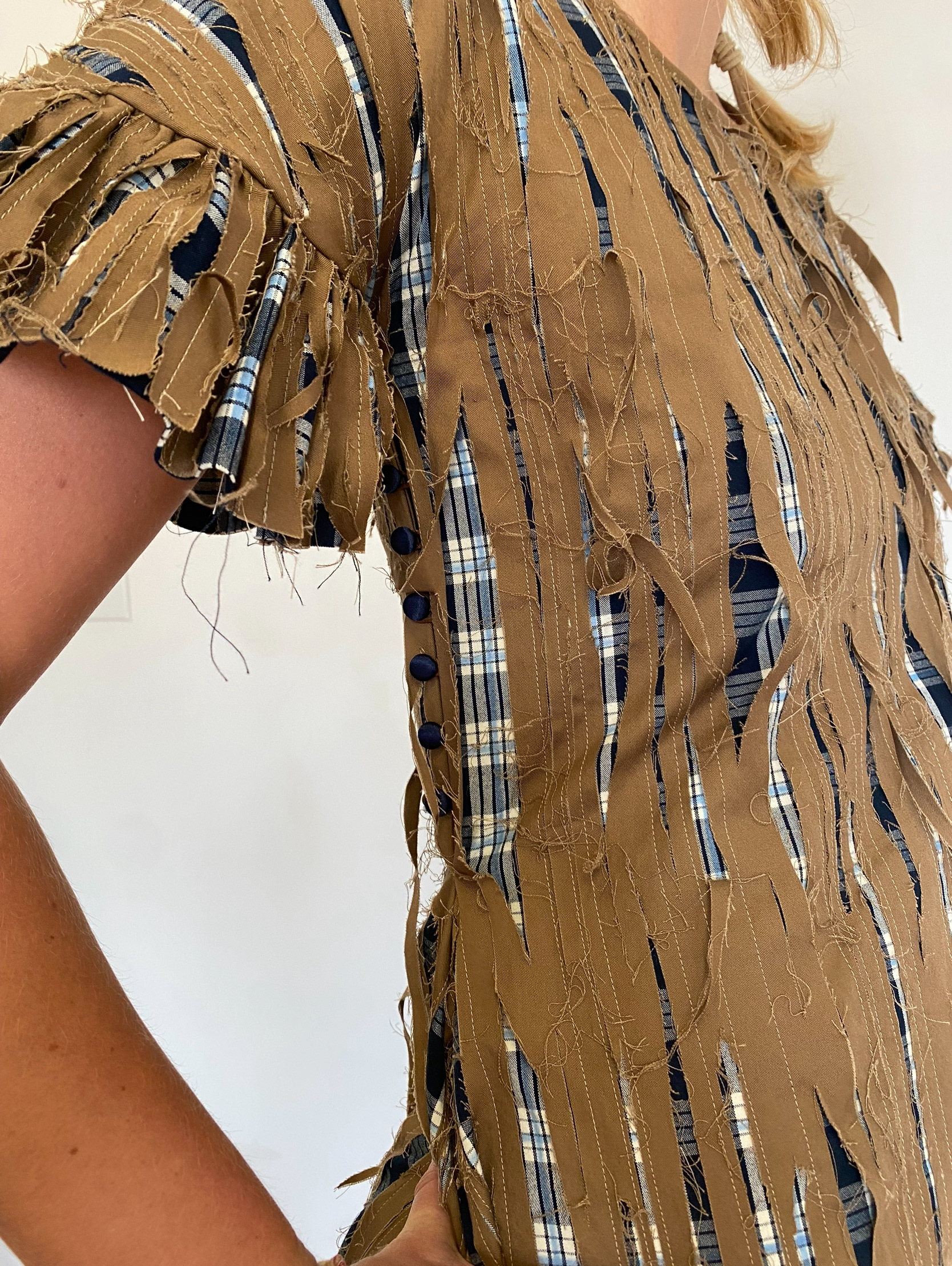 Peeling paint dress fabric manipulation close up 