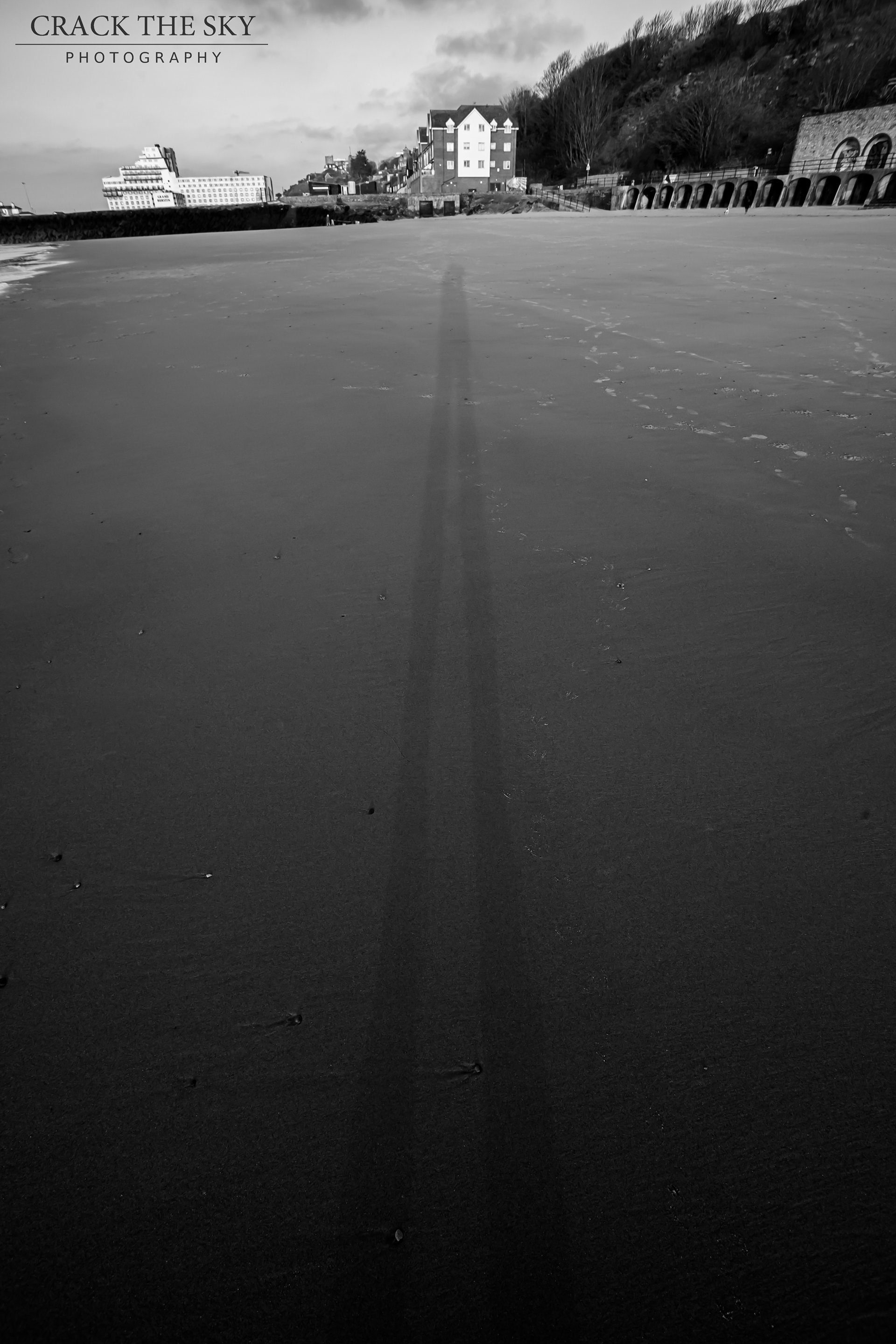 Long shadows on sunny sands, Folkestone, England