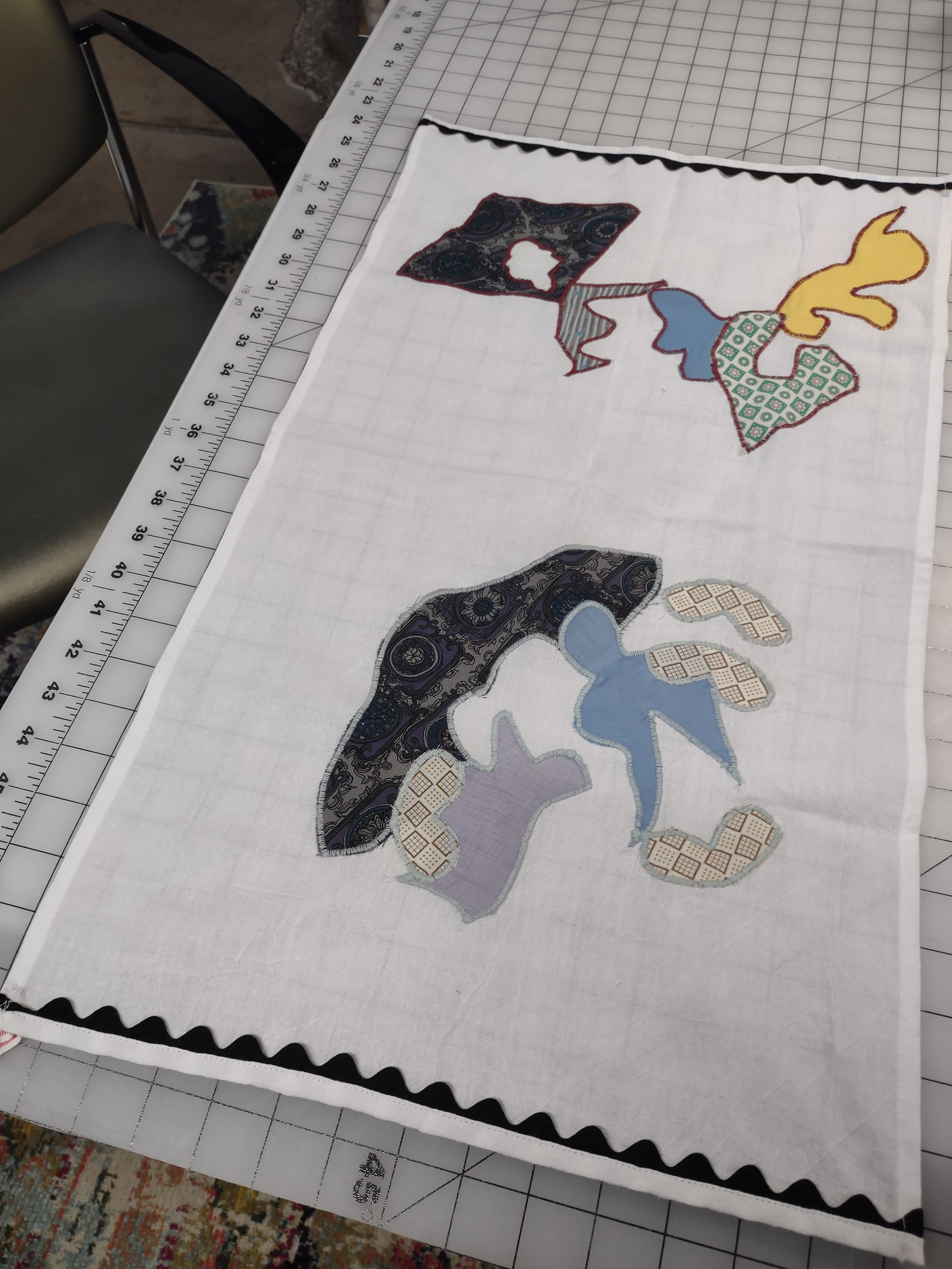 SOLD Vintage Tea Towel with black ric-rac and vintage textile appliques, 25" x 14" $28