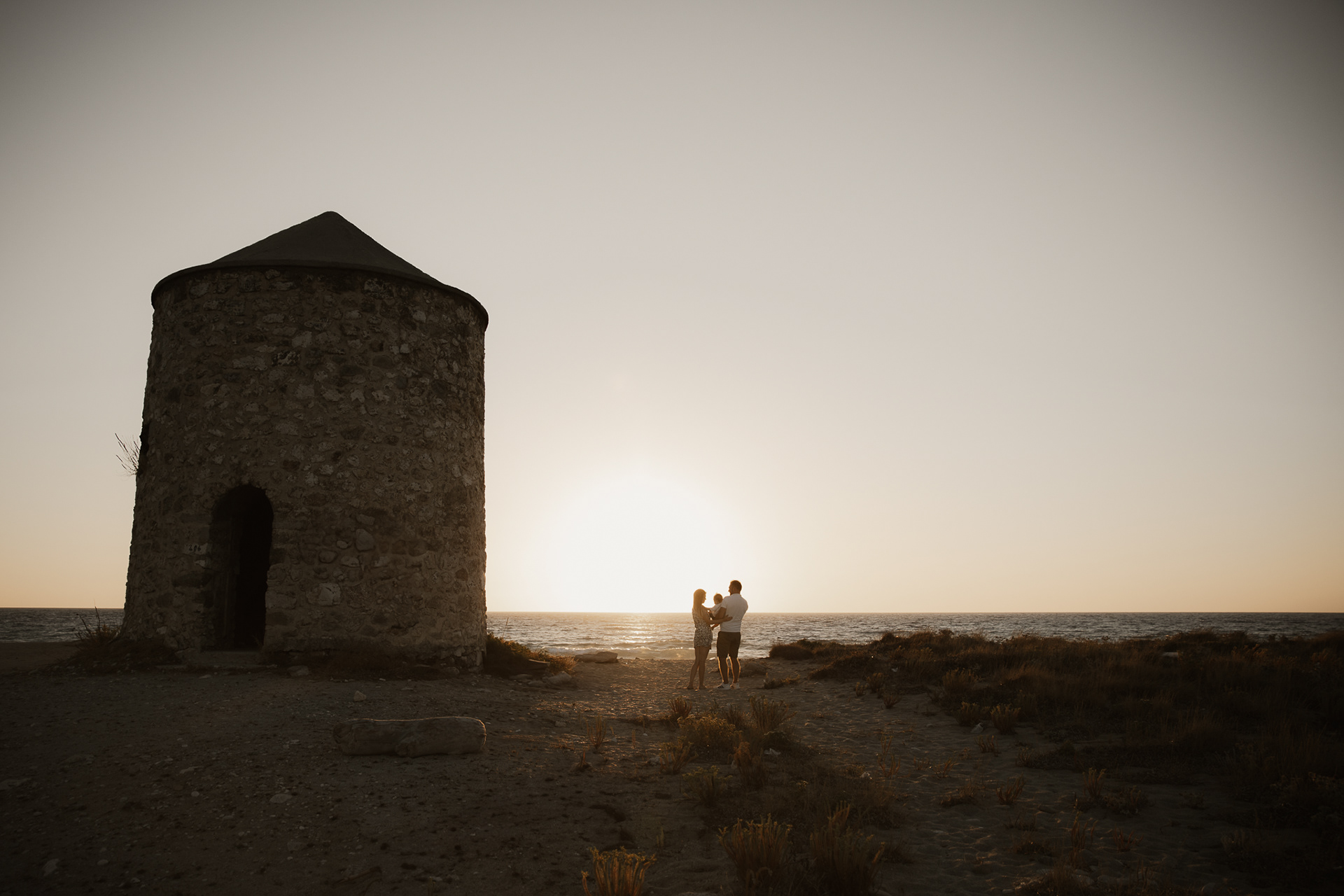 "Couple at sunset by the windmill-Lefkada wedding"