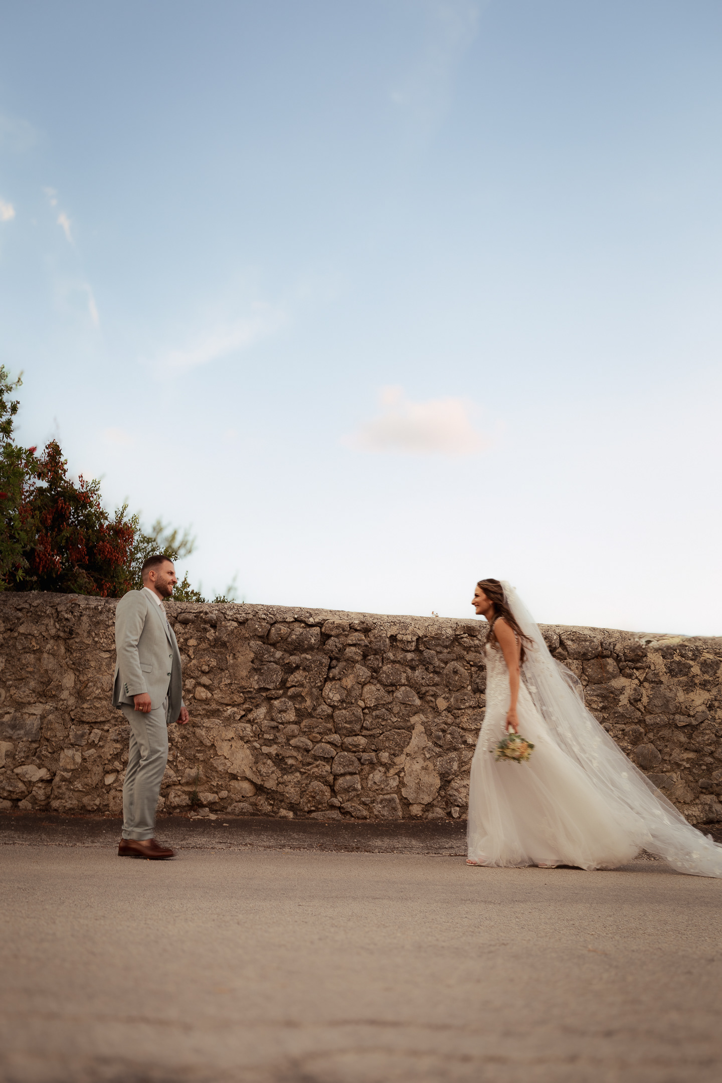 "Bride walking outdoors in Greece"