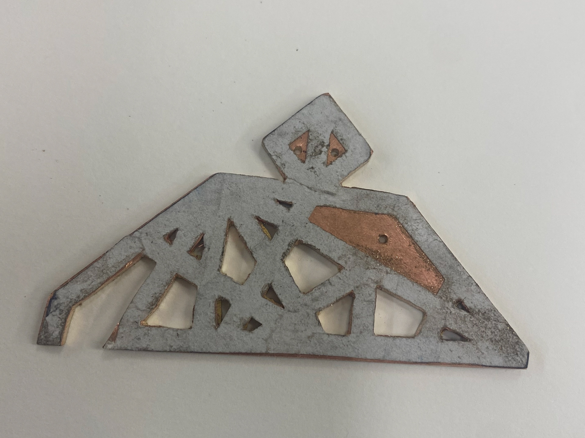 Pieces soldered together being pierced