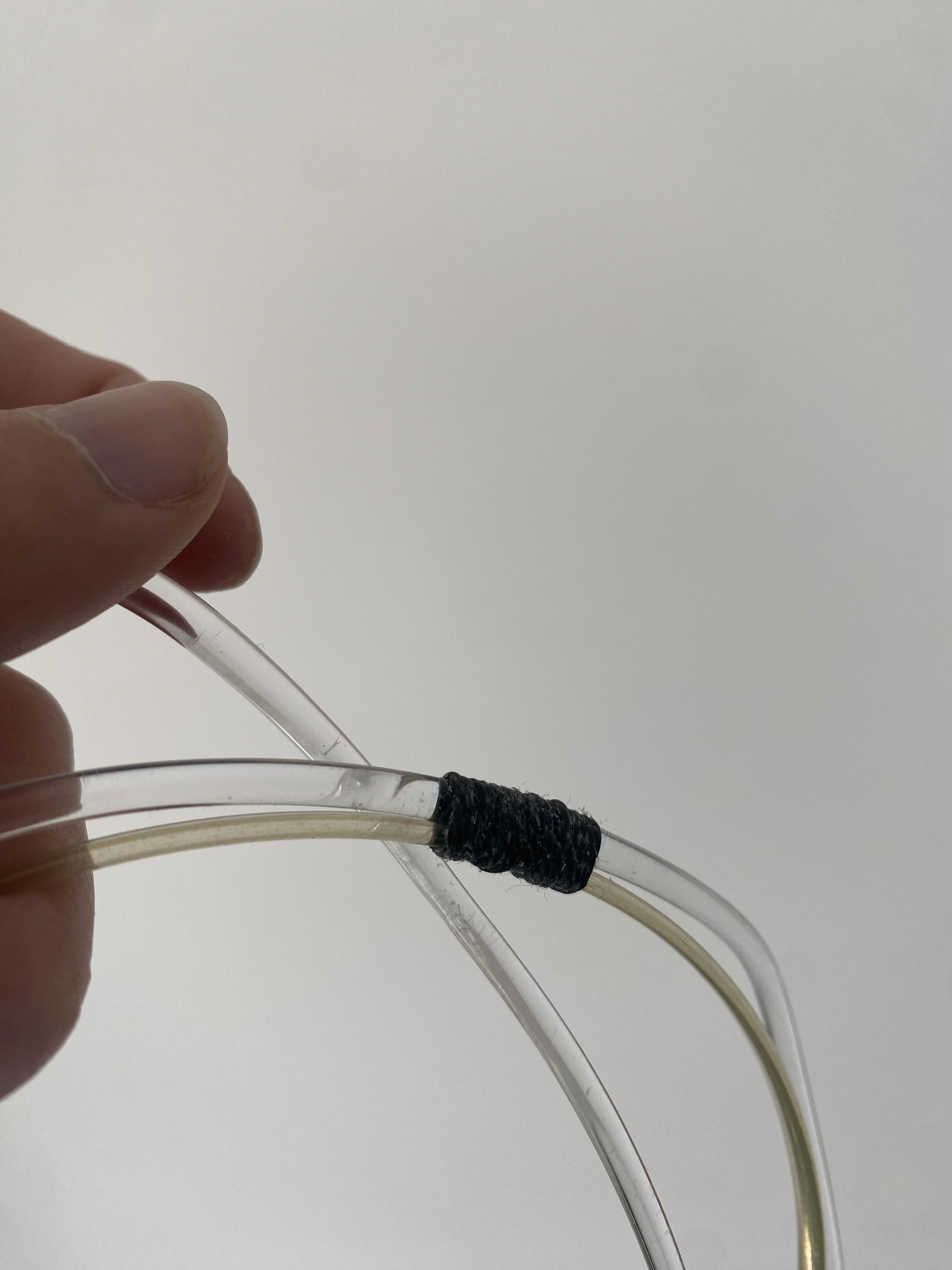 Wrapped black thread