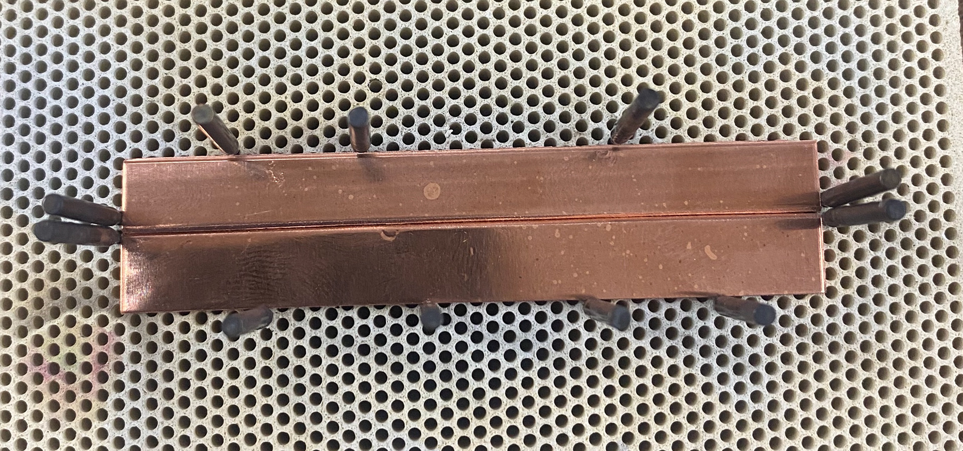 Bevelled metal ready for the tubes to be put in place and soldered