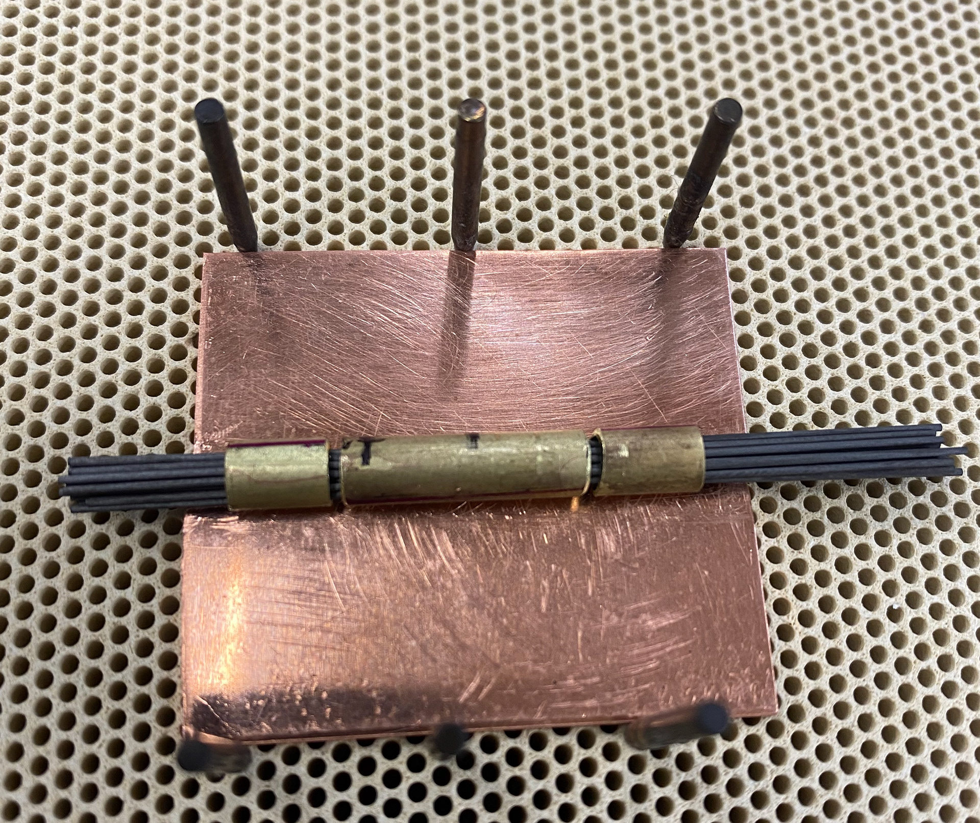 Using graphite to hold the tubes in place ready for soldering