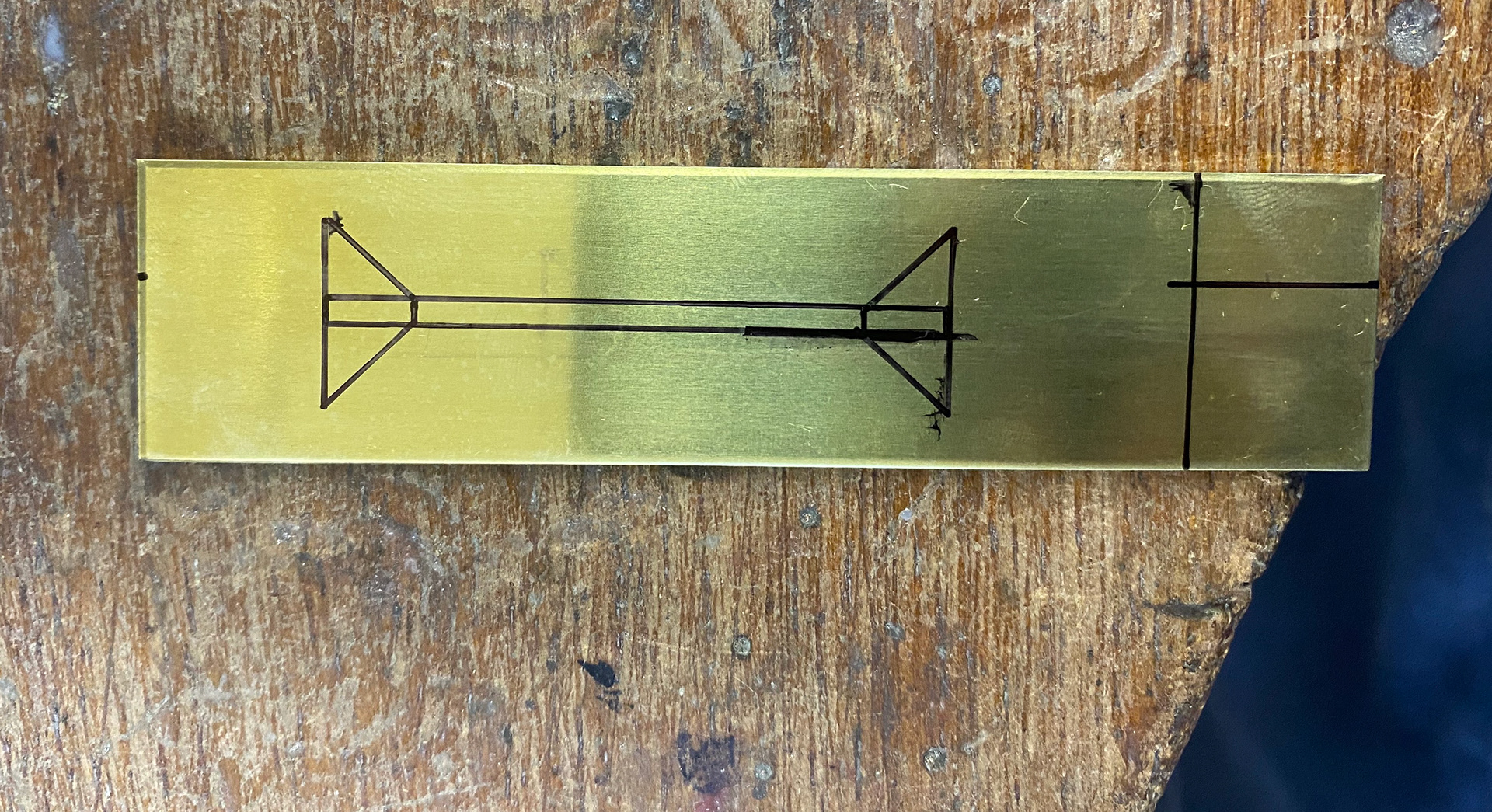 Design draw onto brass ready to cut out.
