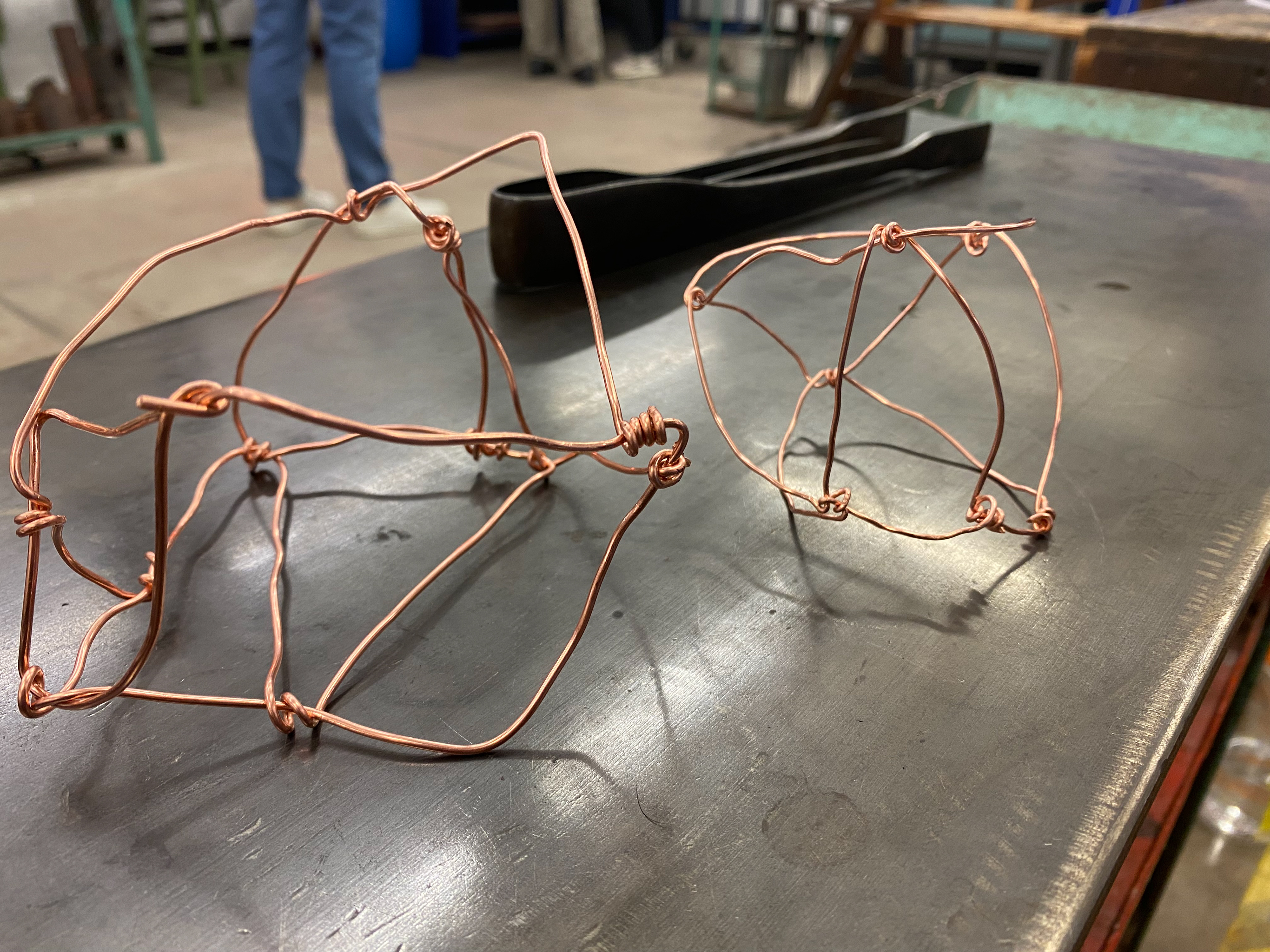 The copper cages i created using copper wire and pliers to bend and twist the wire to connect it.