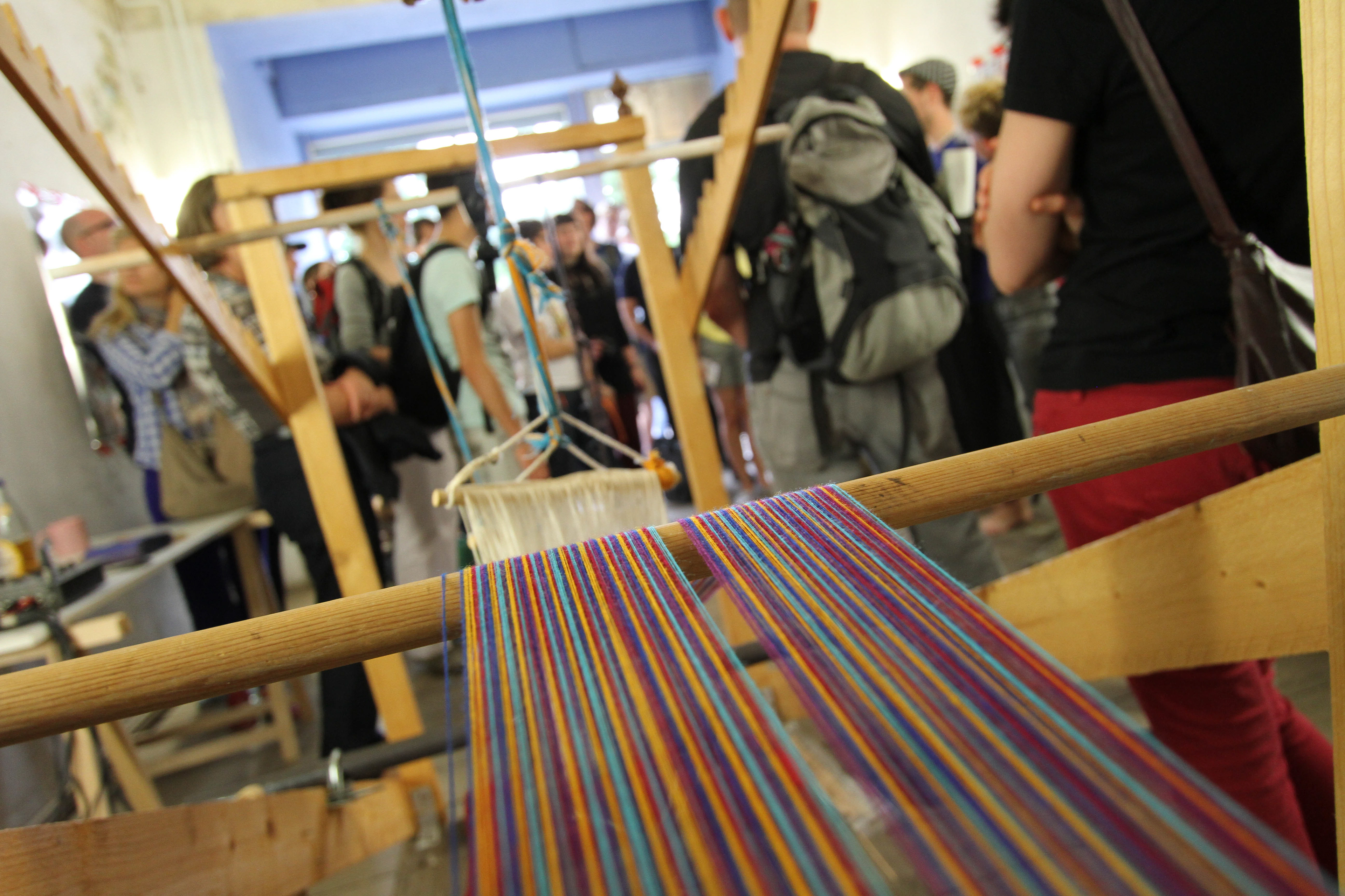 Photographic documentation from the project "Weaving the Social Fabric", by Meyrick Kaminski. Demonstration of the loom, Berlin, June 2013.