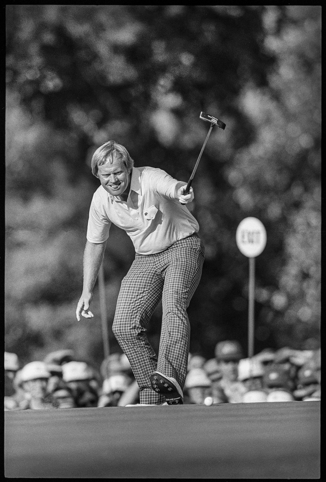 Jack Nicklaus sinking his putt on the 17th green during the final round of the 1986 masters Tournament at Augusta National Golf Club. He was 46 at the time and won the tournament by one stroke in a dramatic come from behind final round.