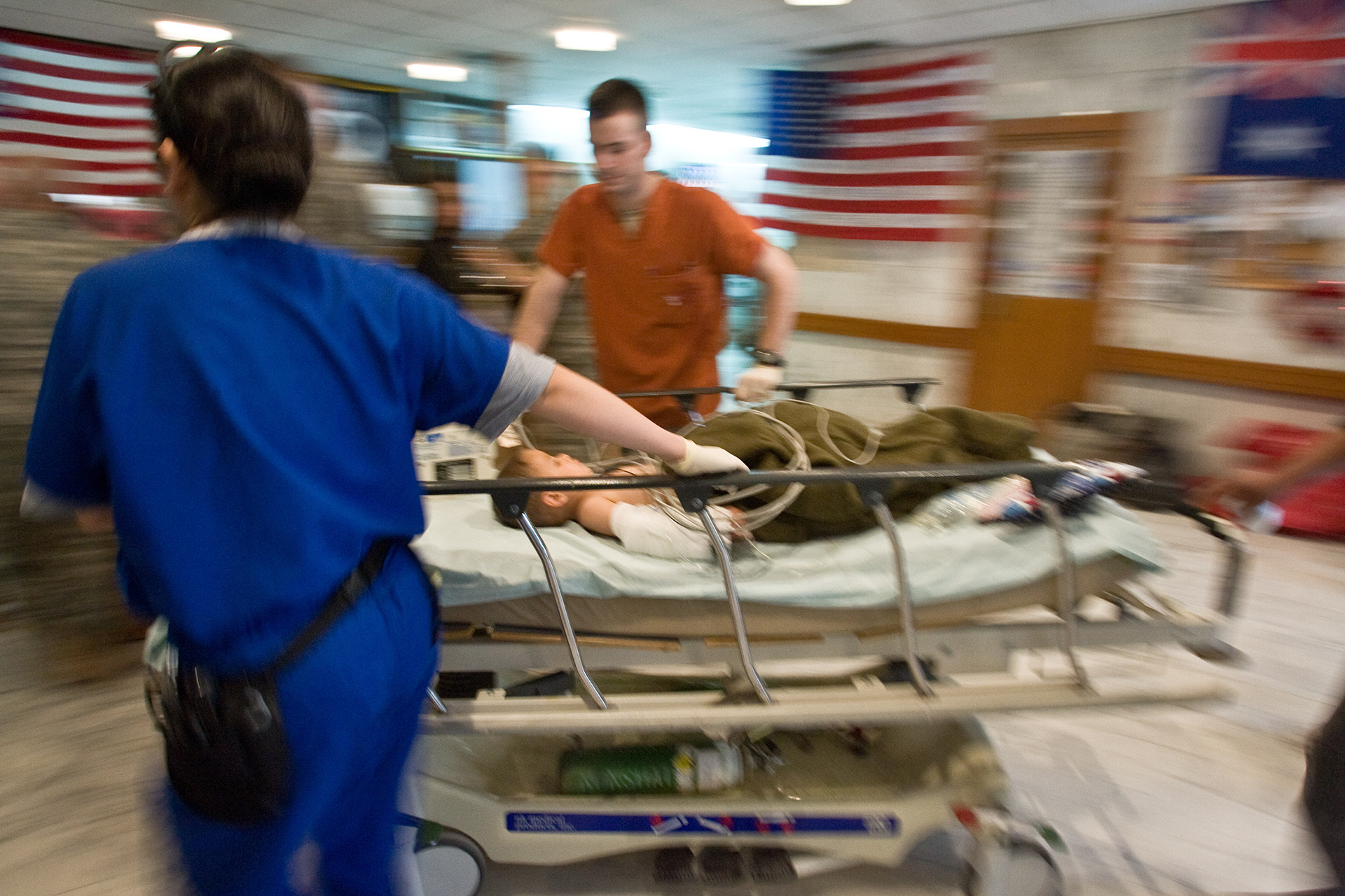 A young Iraqi girl is wheeled from X-ray back to a trauma room in the 28th Combat Support Hospital.
