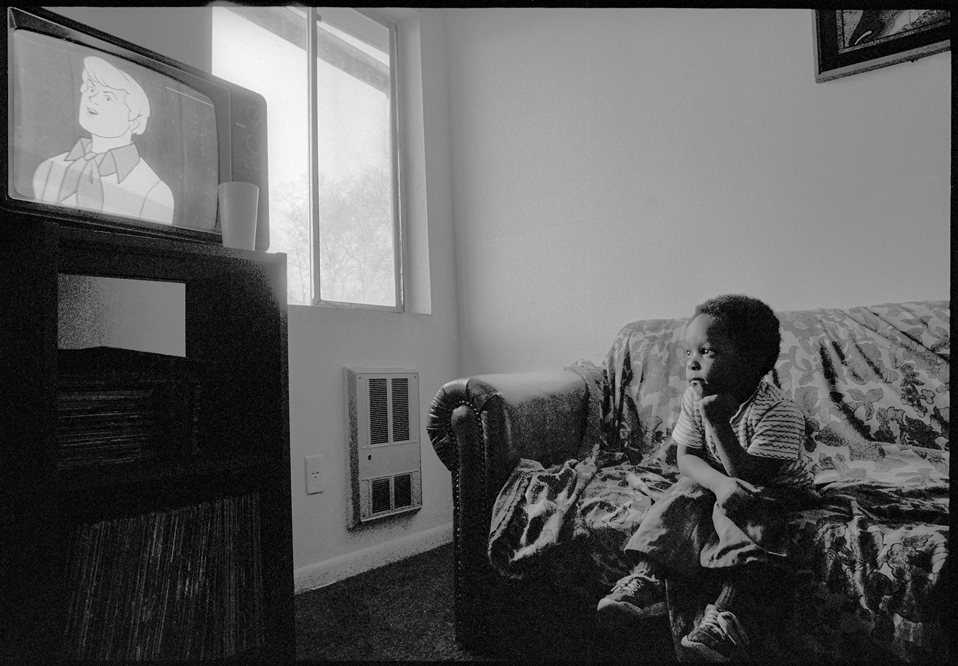 Young man watching cartoons in Atlanta, 1983.