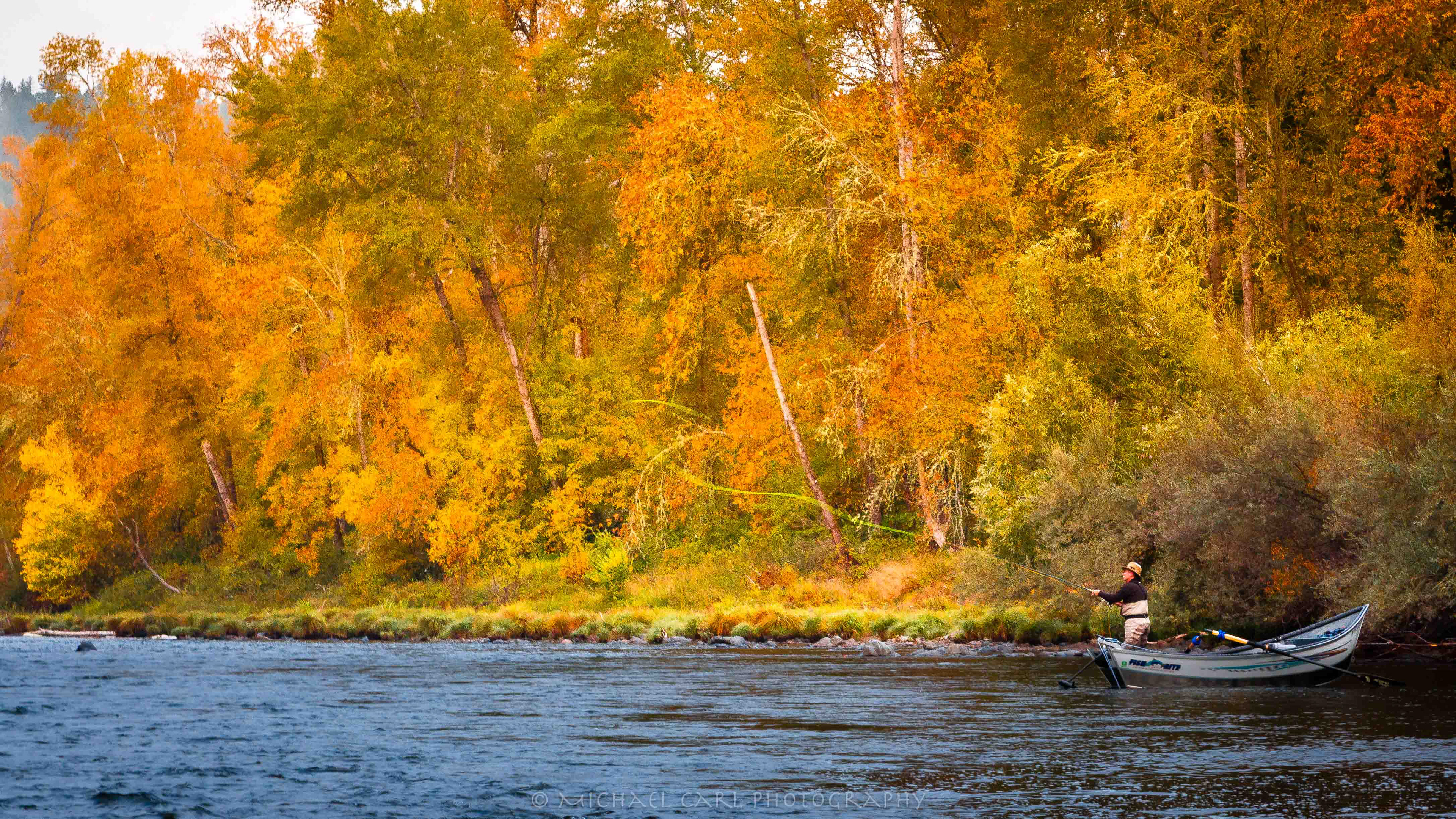 Fly fishing photograph of angler casting on Oregon's  Rogue River just upstream of the Wild & Scenic section.