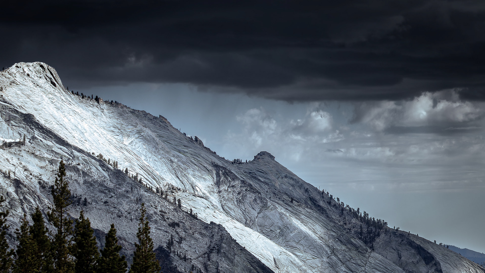 Landscape photograph of threatening skies over Clouds Rest in Yosemite National Park.