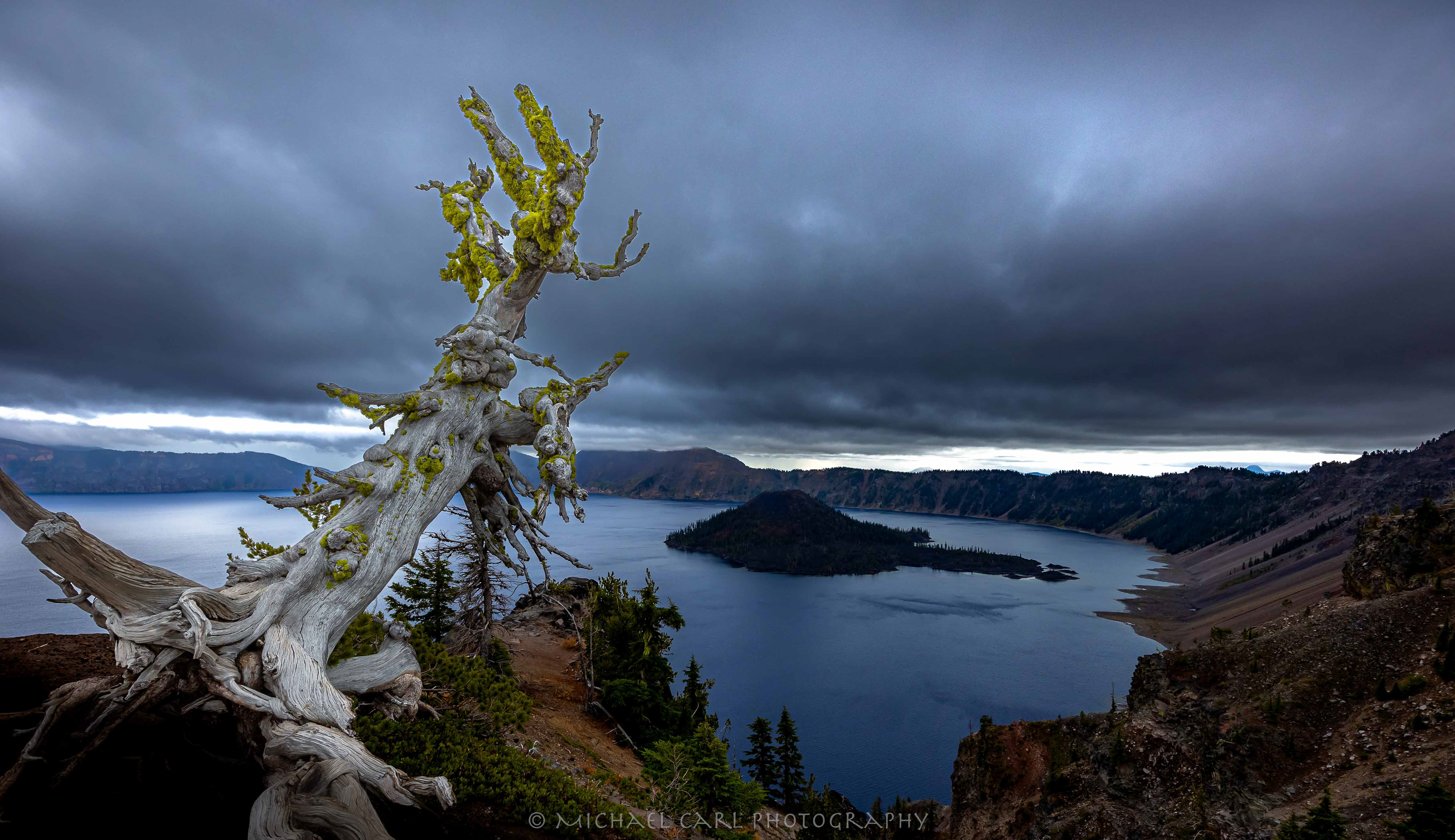 Crater Lake National Park located in the Cascade Mountains of Oregon is the deepest lake in the USA, formed by the now-collapsed volcano, Mount Mazama..