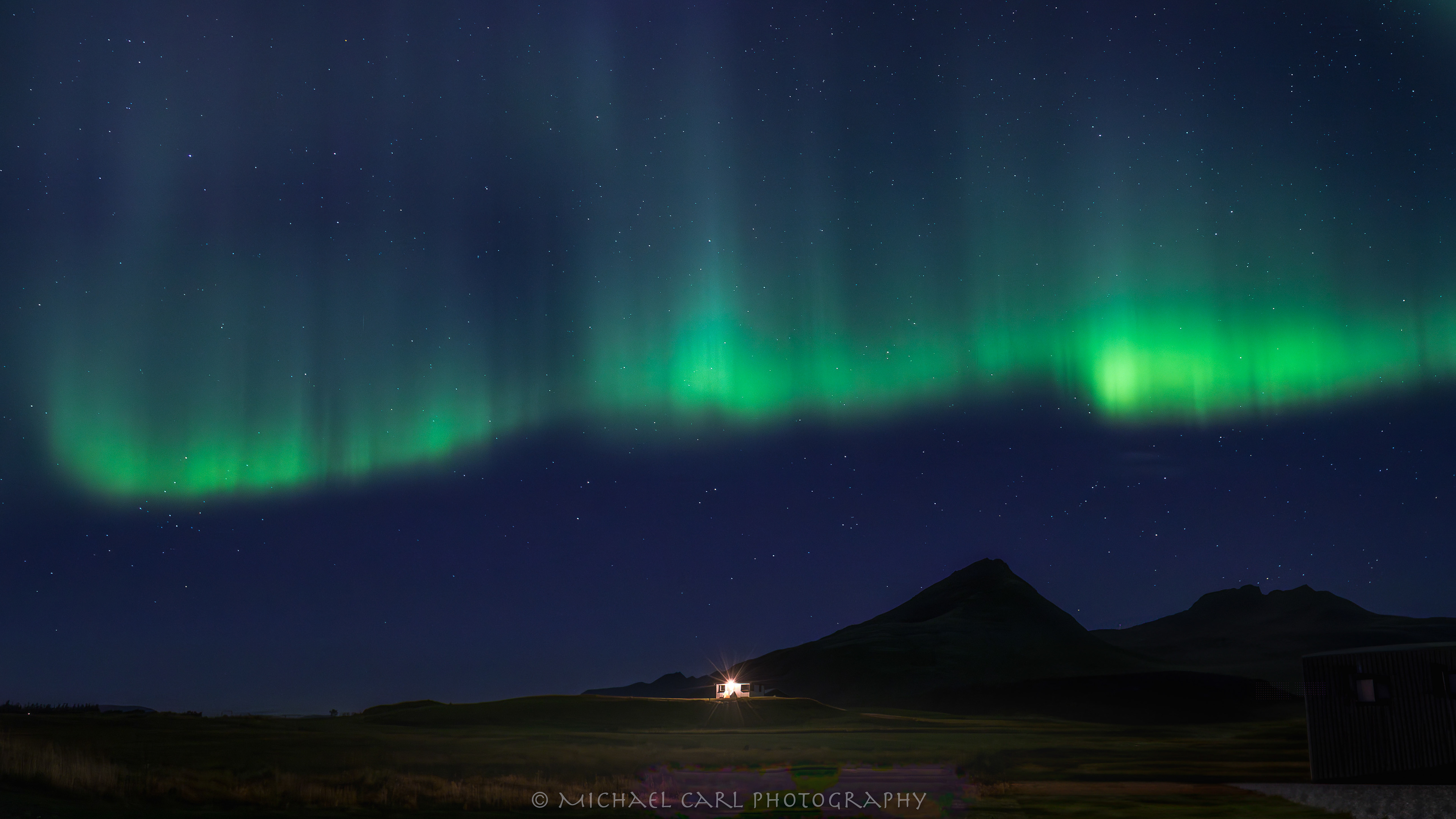 Outdoor adventure photography of Northern Lights above the Arctic Circle